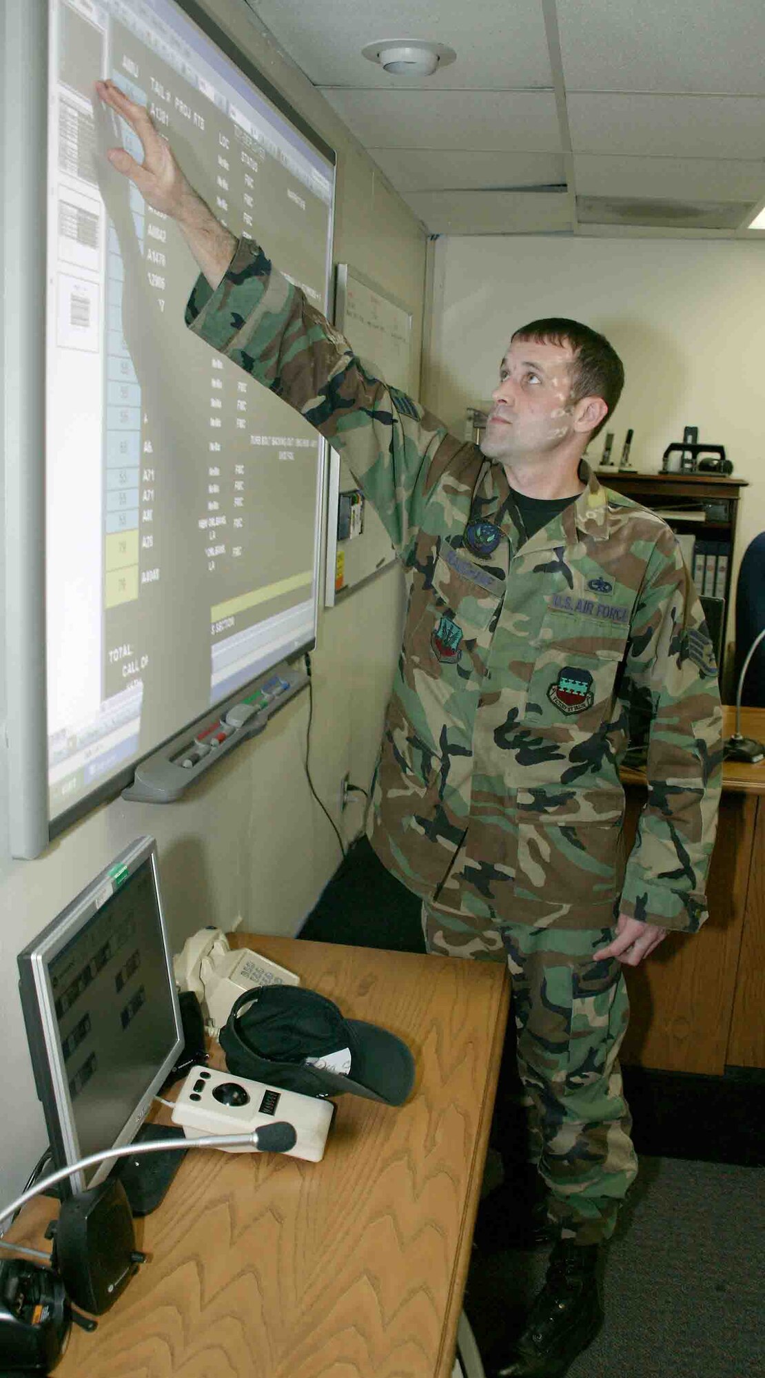 Staff Sgt. Douglas Beauchamp, 20th Maintenance Operations Squadron Maintenance Operations Center controller, updates the flying status board Oct. 16. MOC controllers use the board to track maintenance and flying schedules, and the status of each aircraft. (U.S. Air Force photo/Senior Airman John Gordinier)