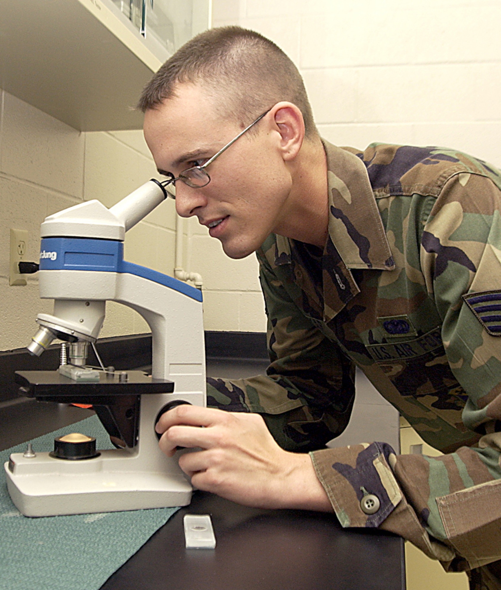 Staff Sgt. Michael Mizikar IV from Dyess Air Force Base, Texas, conducts a particle assessment analysis on a JP-8 fuel sample during a fuels course at the 366th Training Squadron. The fuels quality control course at the squadron is relocating to Fort Lee, Va., where the Air Force, Army and Marines will train in a joint environment. (U.S. Air Force photo/Harry Tonemah)                               