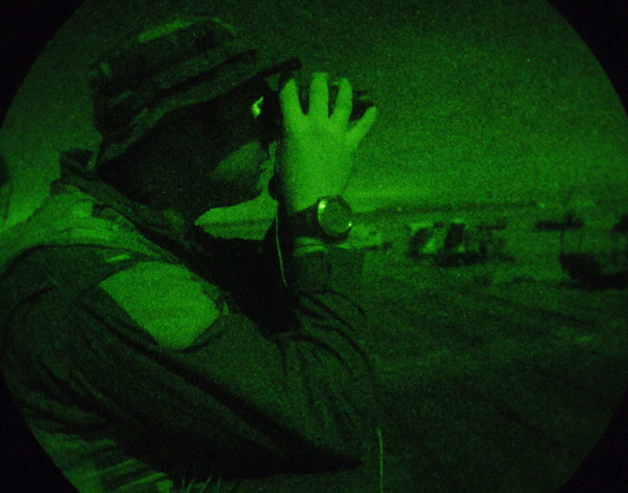 Captain Justin Williams searches for enemy role-players on a night-rescue scenario during Exercise Atlantic Rescue at Avon Park Air Force Range, Fla., Nov. 1. He is an F-15E Strike Eagle weapons systems operator stationed at Langley Air Force Base, Va. (U.S. Air Force photo/Tech. Sgt. Larry A. Simmons) 
