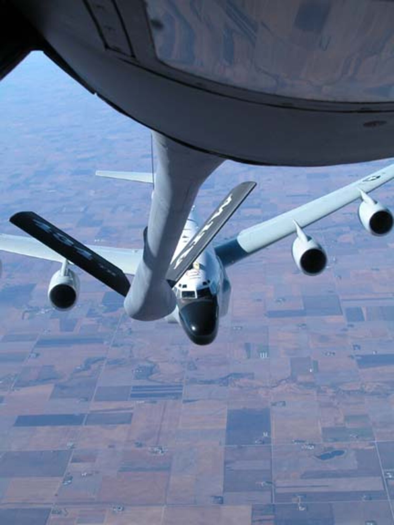 GRISSOM AIR RESERVE BASE, Ind -- An RC-135 from Offutt, AFB, Neb., pulls up behind a KC-135R Stratotanker from the 434th Air Refueling Wing at Grissom ARB, Ind. during an aerial refueling mission on Oct 31. The refueling mission also afforded media  members of the north central Indiana area an opportunity to learn more about Grissom, the 434th ARW and the Air Force Reserve Command by participating in the mission. (U.S. Air Force photo/Tech. Sgt. Doug Hays)