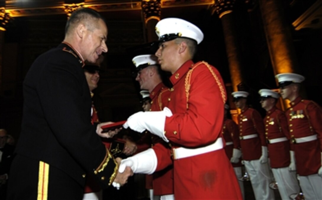 Chairman of the Joint Chiefs of Staff Marine Gen. Peter Pace congratulates members of the U.S. Marine Drum and Bugle Corps during the Marine Corps Birthday Ball in New York City, Nov. 1, 2006. Pace was the military guest of honor at the gala that paid tribute to the Marine Corps.