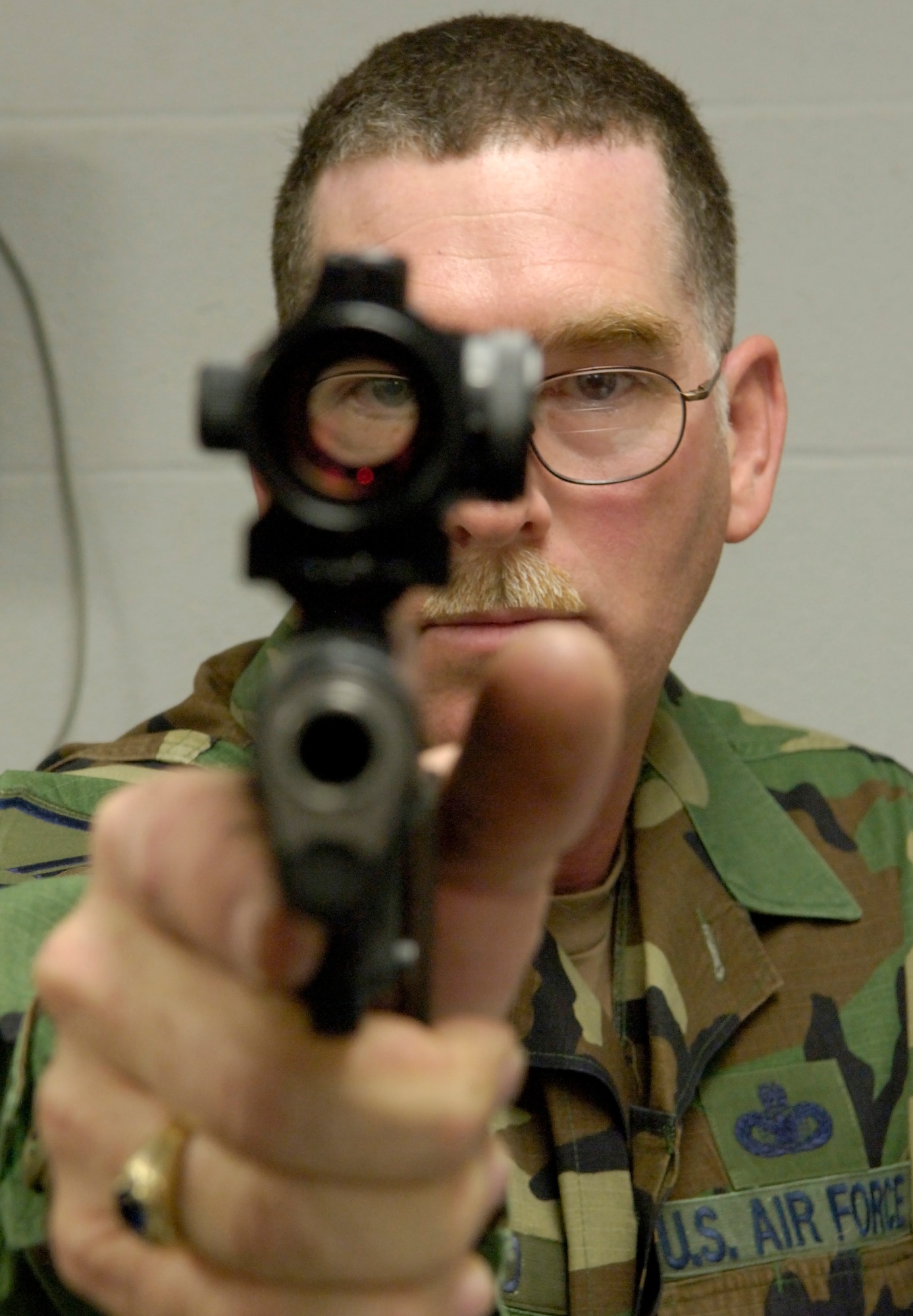 Master Sgt. Daniel Norwood checks a 45-caliber centerfire pistol after inspection. Sergeant Norwood, who is a member of the Arkansas Air National Guard, is the Air Force's only military gunsmith.  (U.S. Air Force Photo/Master Sgt. Jack Braden)