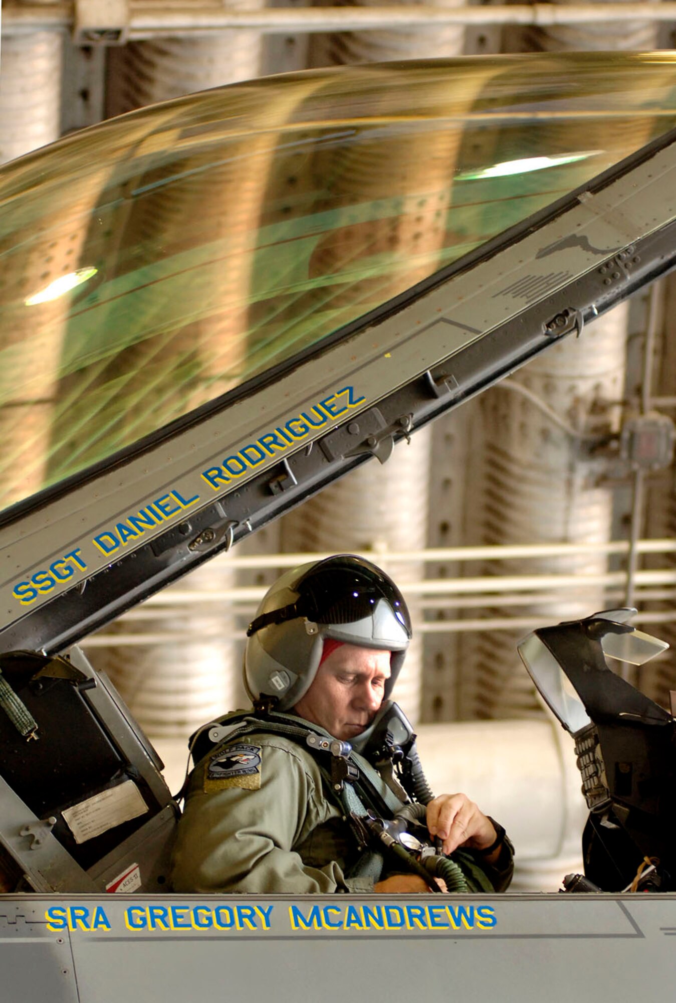 Colonel Jeffrey Lofgren, 8th Fighter Wing commander, secures his gear and straps into an F-16 Fighting Falcon at Kunsan Air Base, South Korea. (U.S. Air Force photo/Daren Reehl)