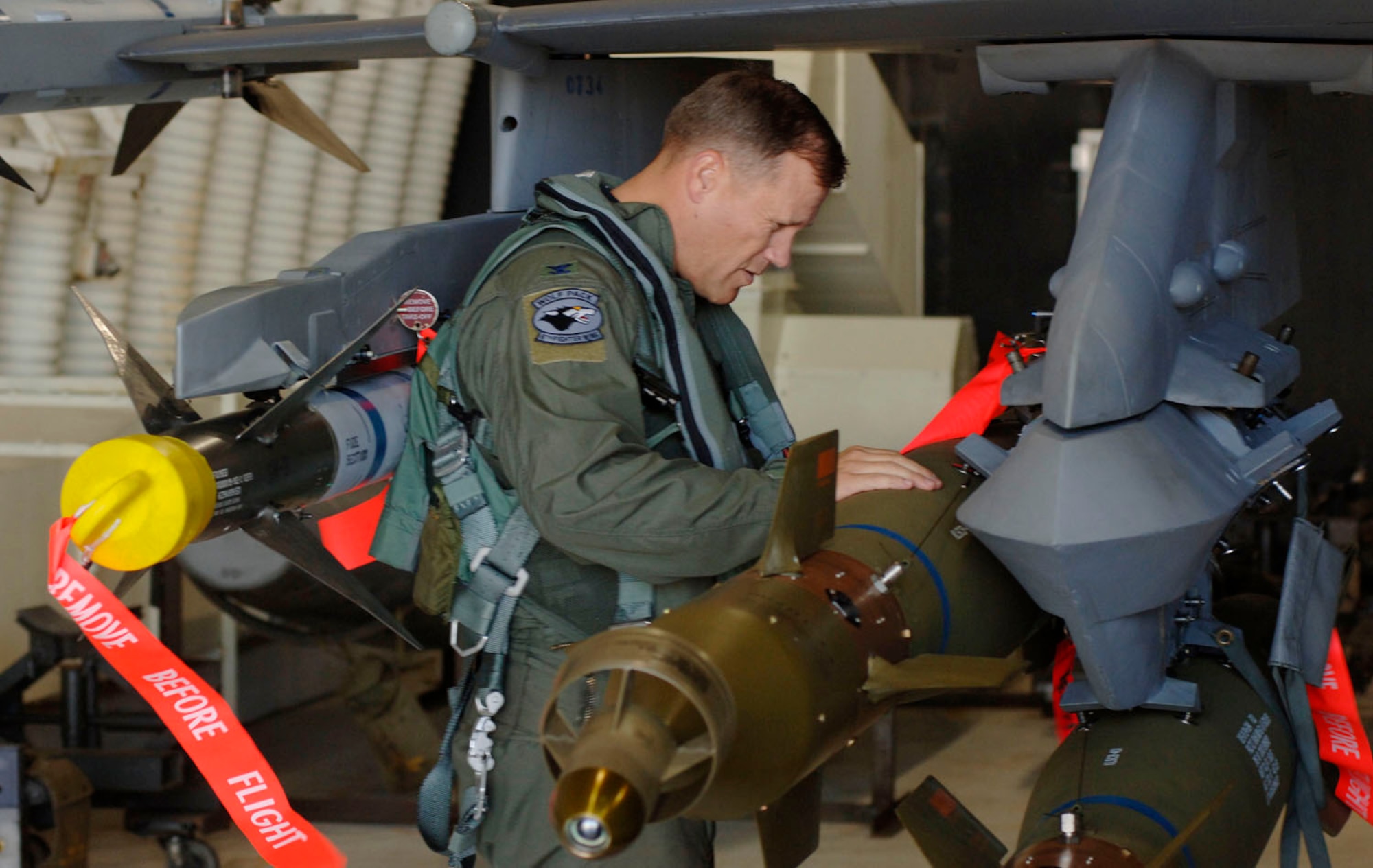 Colonel Jeffrey Lofgren, 8th Fighter Wing commander, performs a preflight check to make sure everything is in order before a mission in an F-16 Fighting Falcon at Kunsan Air Base, South Korea. (U.S. Air Force photo/Daren Reehl)