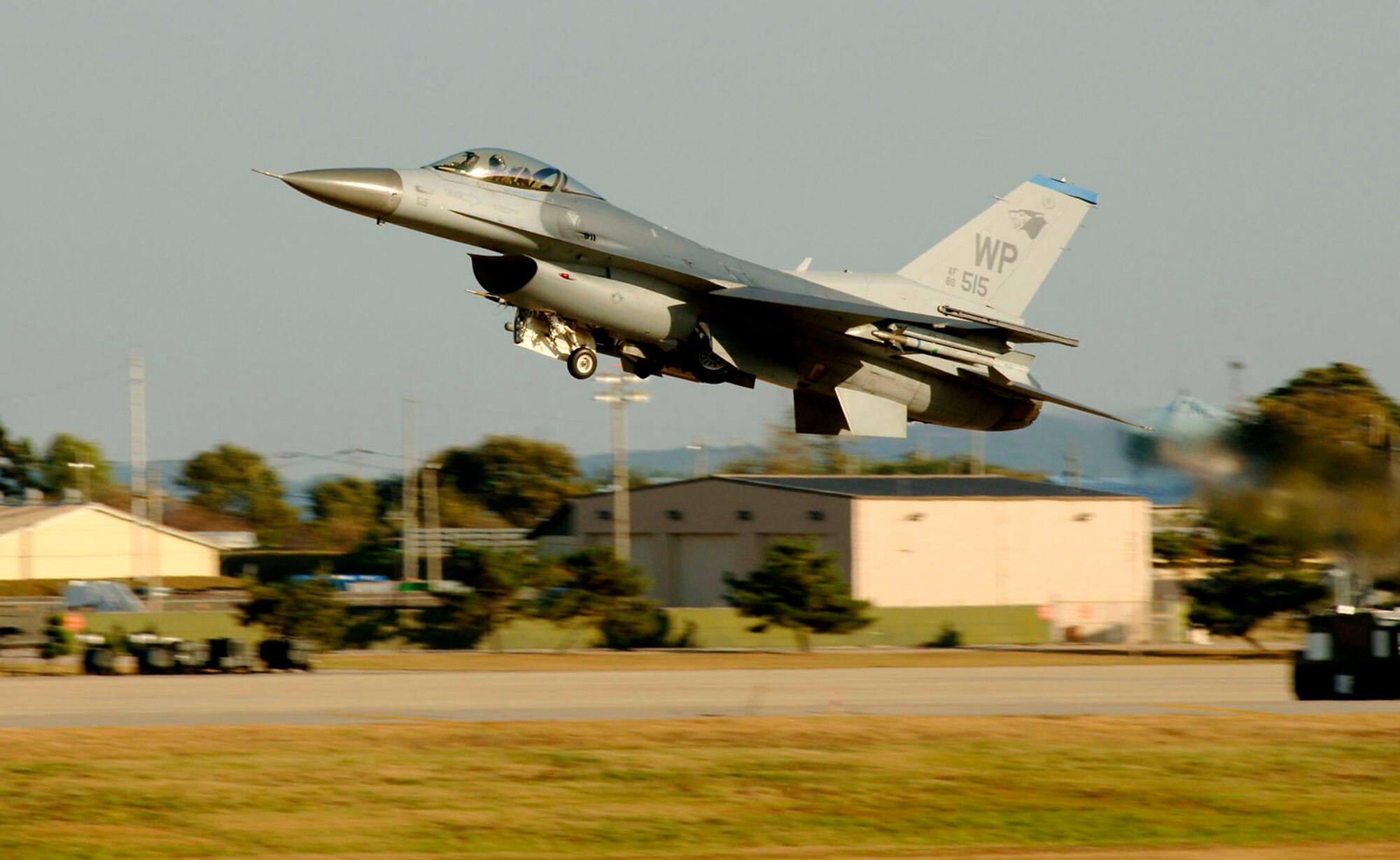 An F-16 Fighting Falcon takes off from a runway at Kunsan Air Base, South Korea. Aircraft are always at the ready, flying training missions around the clock to ensure total readiness. (U.S. Air Force photo/Daren Reehl)