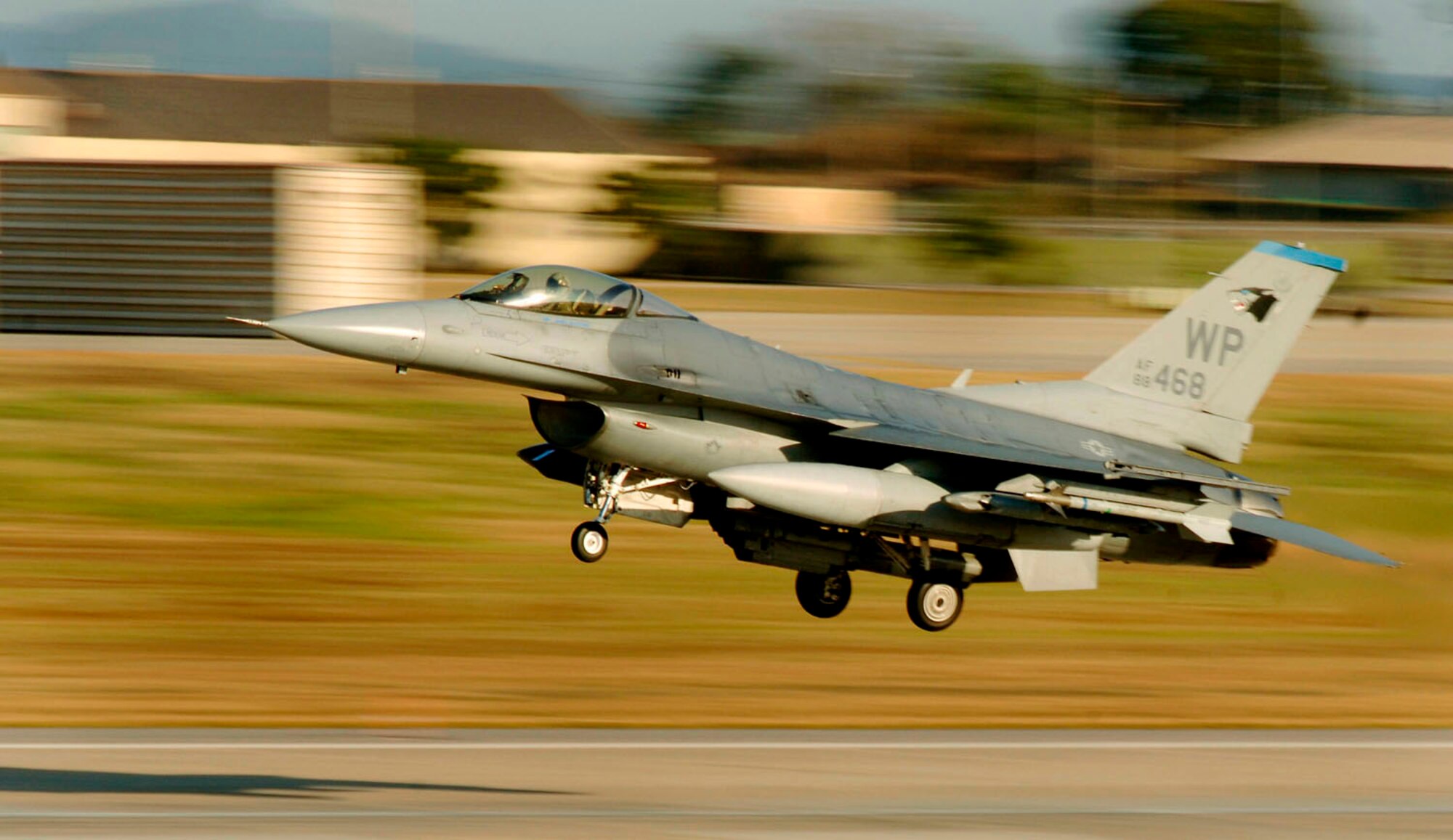An F-16 Fighting Falcon takes off from a runway at Kunsan Air Base, South Korea. Aircraft are always at the ready, flying training missions around the clock to ensure total readiness. (U.S. Air Force photo/Daren Reehl)