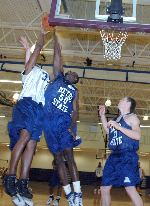 BUCKLEY AIR FORCE BASE, Colo. -- Moussa Coulibaly (50), from Metropolitan State Community College, blocks Airman 1st Class Jammar Major (35) during a scrimmage between Metropolitan State and the 2006 All Air Force Men's Basketball team at the Fitness Center here Nov. 2. Metro State won the contest 95-64. Airman Major is from the 16th Equipment Maintenance Squadron, Hurlburt Field, Fla. (U.S. Air Force photo by Airman Christopher Bush)