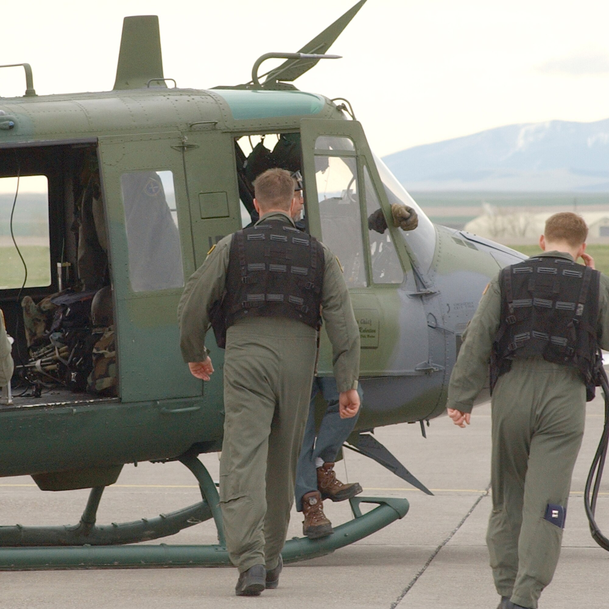 Captains Shane Werley (left) and Marc Milligan head to a UH-1N Huey helicopter before departing for their Guardian Challenge competition in May. The two seasoned pilots have been selected to deploy in support of the Global War on Terrorism to train Iraqi nationals to fly combat missions.  