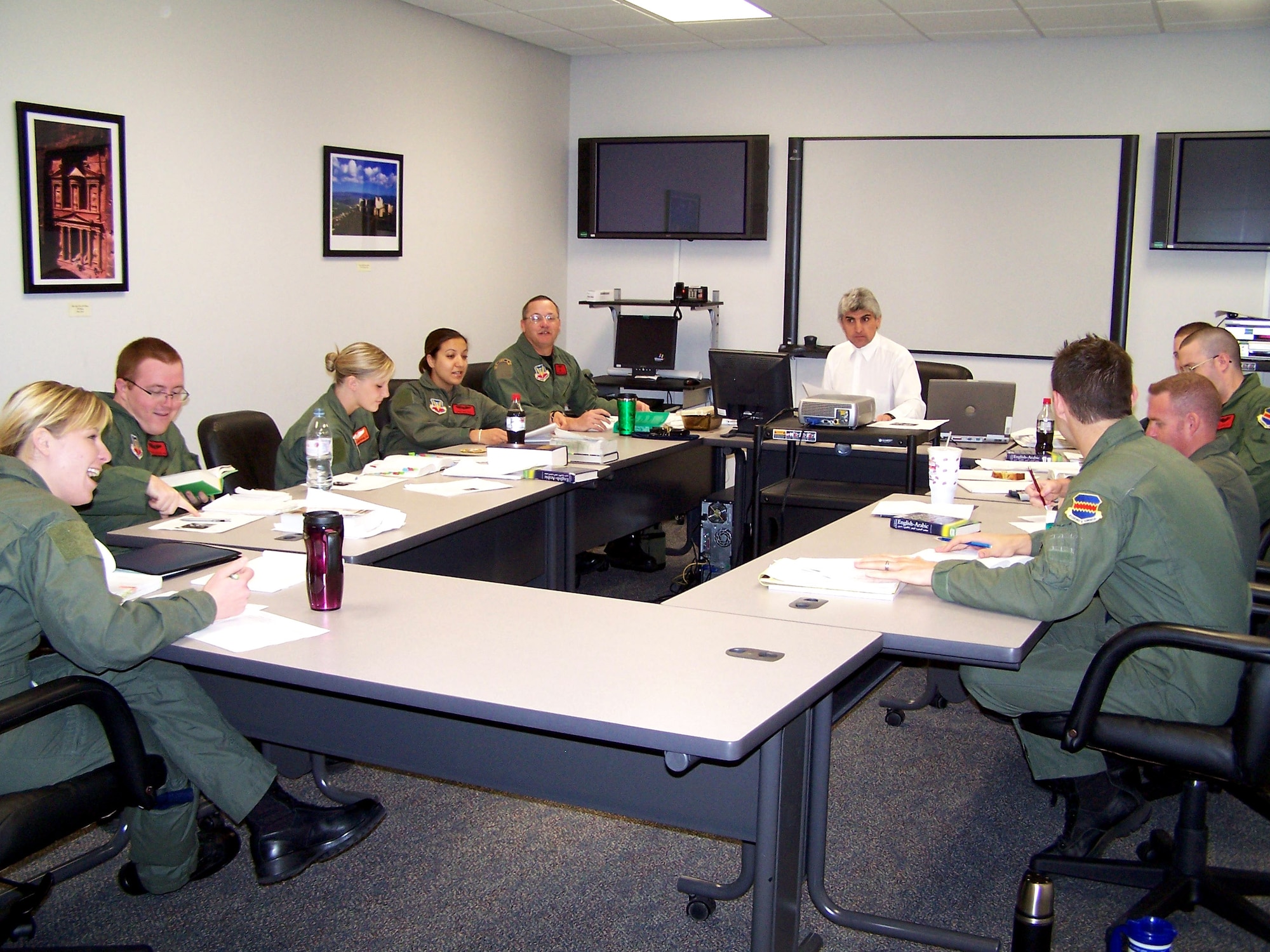 Jonas Shimon, Defense Language Institute instructor, teaches a group of language analysts at the language learning center at Offutt Air Force Base, Neb. (U.S. Air Force photo)

