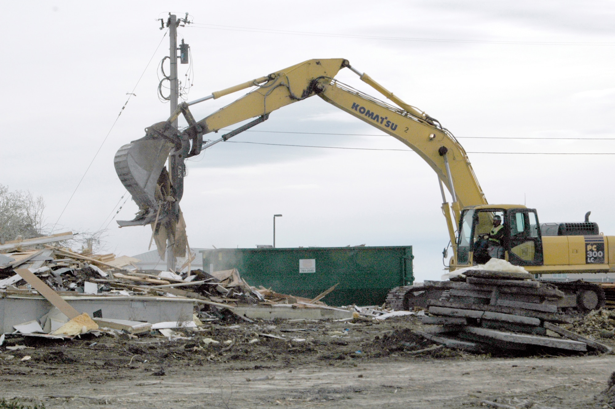 Construction crews work to remove debris from demolished housing units on Washington Circle, behind Lincoln Drive. These units, along with half of thos e on Lincoln Drive, are slated for replacement during Phase A of the sixth stage of the housing replacement project here. The remaining units on Lincoln Drive will be destroyed and replaced during Phase B.