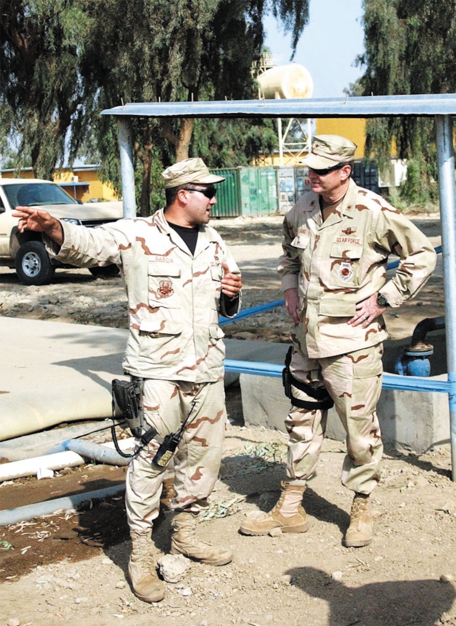 Airman 1st Class Francisco Garcia briefs his responsibilities to Brig. Gen. Robin Rand the 332nd Air Expeditionary Wing commander at Camp Habbaniyah. Airman Garcia is a civil engineer technician with the 732nd Expeditionary Regional Support Unit. (U.S. Air Force photo/1st Lt. Landon Derentz)                                