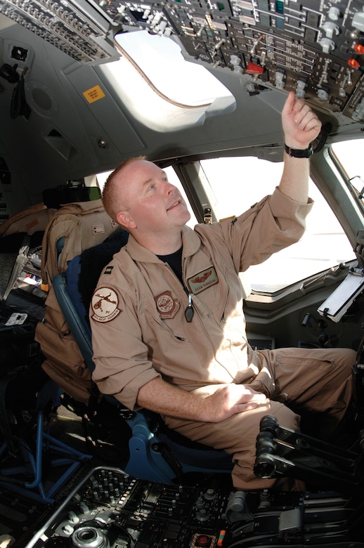 Capt. Adam Bingham, 816th Expeditionary Airlift Squadron, performs preflight procedures on a C-17 aircraft for an aeromedical evacuation mission.
