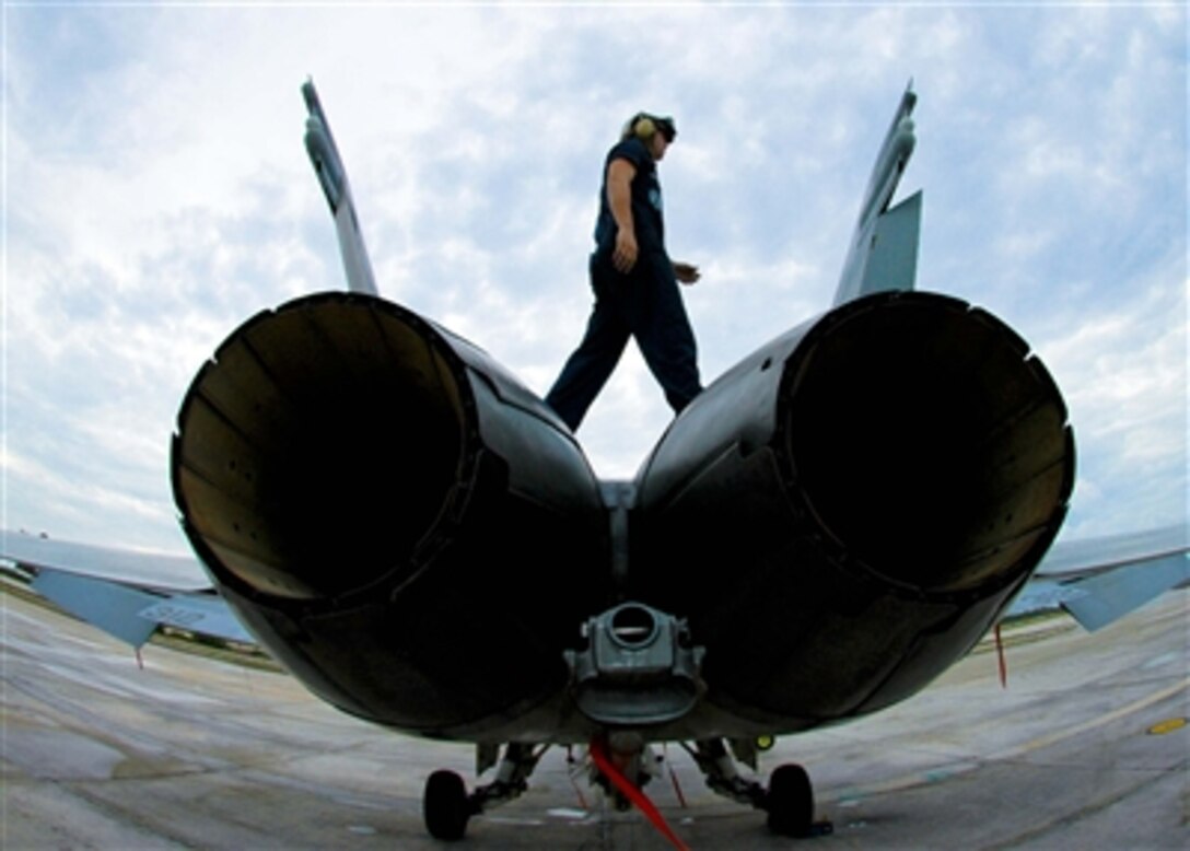 Airman Robert Leggett of Strike Fighter Squadron 37 performs a routine turnaround inspection on an F/A-18 Hornet at Naval Air Station Key West, Nov. 2, 2006.
