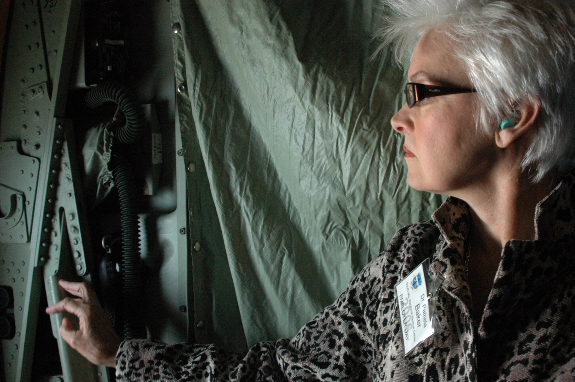 Dr. Pamela Baker, from South Mississippi Regional Medical Center, gazes out a window aboard a WC-130J Hurricane Hunter aircraft during the 403rd Wing's annual Employer Appreciation Day. Dr. baker joing more than 30 other employers from the Gulf Coast region visiting the Air Force Reserve Command unit and learning what their Reservists do while on duty.