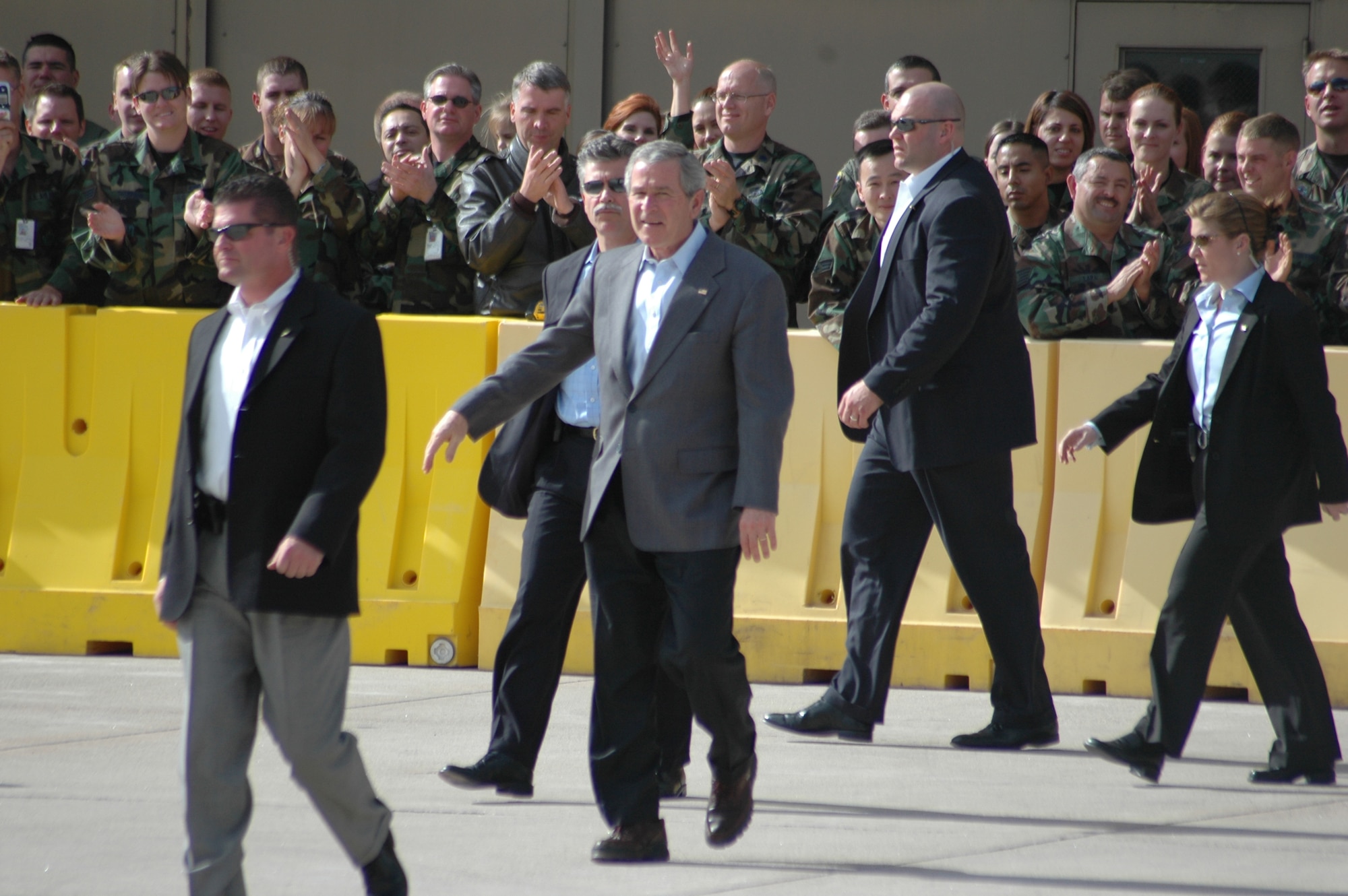 President George W. Bush walks back from meeting and shaking hands with about 50 Colorado Air National Guard members outside of Hangar 909 before he flew out of Buckley Air Force Base Nov. 4 after a one-night visit to attend the Colorado Victory Rally 2006 in support of U.S. Rep. Marilyn Musgrave's congressional campaign.
He arrived Nov. 3 as part of his last-minute national campaign tour to shore up Republican candidates engaged in tight races. (U.S. Air Force photo by Staff Sgt. Sanjay Allen)