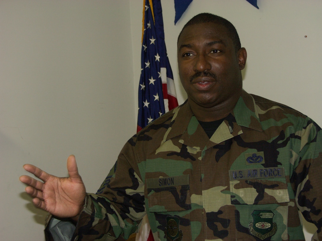 Master Sgt. Freddie Simon makes a point about patriotism as he speaks with Tech Sgt. Dan Oliver, Gateway rnewspaper reporter.