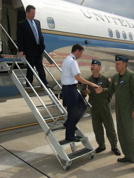 Master Sgt. James Gallagher, flight attendant, and Maj. Ralph DePalma, pilot, are welcomed back by Col. Thomas Kirkendall, 932nd Operations Group commander and Col. Jeff Johnson, 932nd Airlift Wing vice commander.