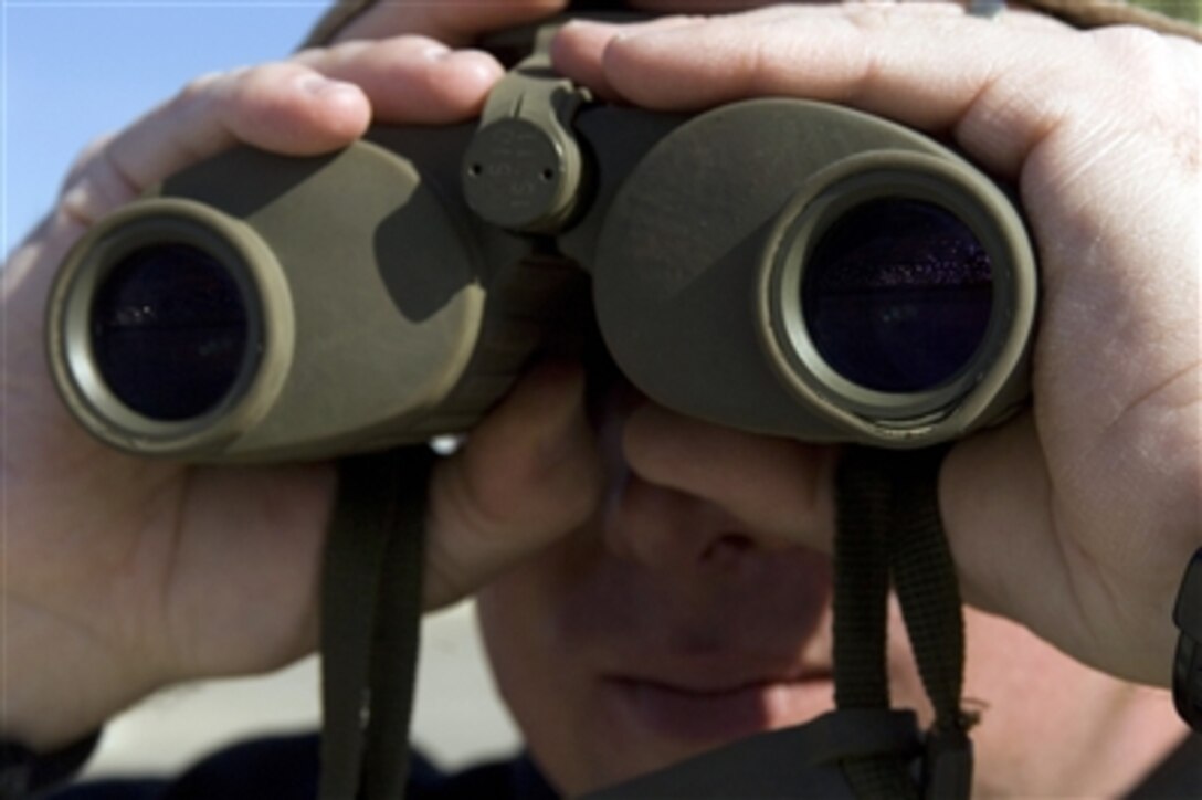 Master Sgt. Greg Palmer scans the crowd at Little Rock Air Force Base, Ark., Nov. 4, 2006, looking for any suspicious activity that may endanger spectators or Air Force resources. Palmer is an instructor at the Air National Guard's sniper school and is assigned to the 188th Security Forces Squadron at Fort Smith, Ark. 