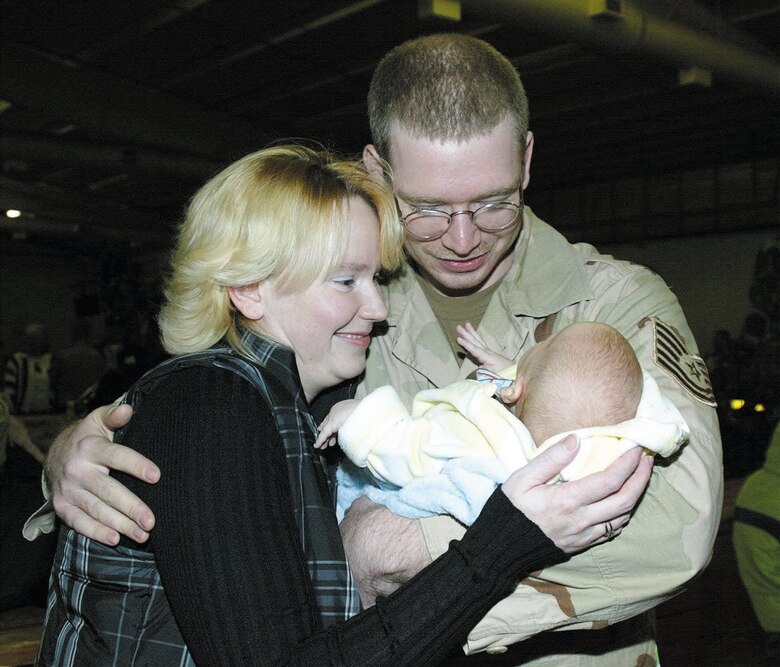 "He's everything I hoped for and more," said Tech. Sgt. Joshua Pattee after returning to Pope Air Force Base, N.C., from a deployment to Southwest Asia. Stephanie Pattee gave birth to Keefe two months before his return. More than 180 Airmen who supported operations in Afghanistan and Iraq were welcomed home by family and friends at Green Ramp Nov. 2. (U.S. Air Force photo/Senior Airman Cassandra Locke) 
