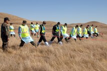 Members from Travis Air Force Base, Calif., and the Solano County Coroner's office search step by step together for any items found within the simulated aircraft crash site. The members were part of Exercise "Aircraft Down," a joint exercise between Travis and the surrounding community held Oct. 19.
(Travis AFB, Calif., Released)