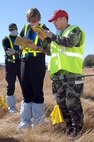 Airman 1st Class Horace White, 60th Civil Engineer Squadron, works with Ms. Susan Parson, a Coroner Forensic Technician from the Solano County Coroner's Office, to map out locations of items found during the search and recovery part of Exercise “Aircraft Down.” Members from Travis Air Force Base, Calif., and the local community held an exercise simulating a crash of a C-5 Galaxy in order to determine how the base and the community would respond to a crisis of this magnitude.
(Travis AFB, CA, Released)