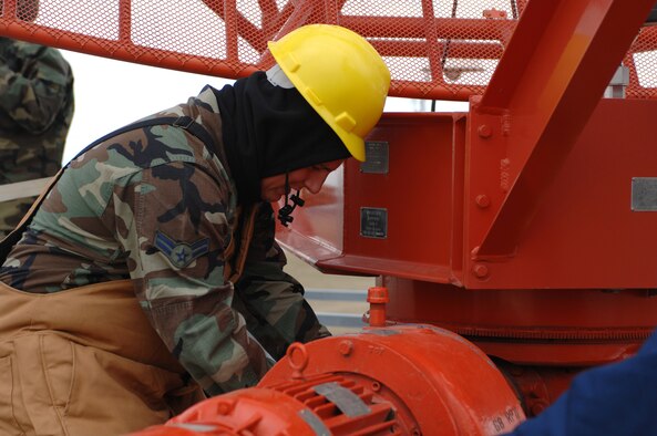 MINOT AIR FORCE BASE, N.D. -- Airman 1st Class David Quelland, 5th Communications Squadron radar maintenance journeyman, swithches out a battery on a radar at the end of the flightline Oct. 27. Airman Quelland is switching out the battery as part of an upgrade to the airport surveillance radar system that assists the radar and approach controllers directly responsible for the safe and expeditious movement of air traffic here, Minot International Airport and 10 surrounding satellite airports. When the radar is incorporated into the RAPCON’s air traffic equipment, it allows for real-time tracking and monitoring of all air traffic encompassing 4,800 square miles from Minot up to 23,000 feet.  (U.S. Air Force photo by Airman 1st Class Christopher Boitz) 