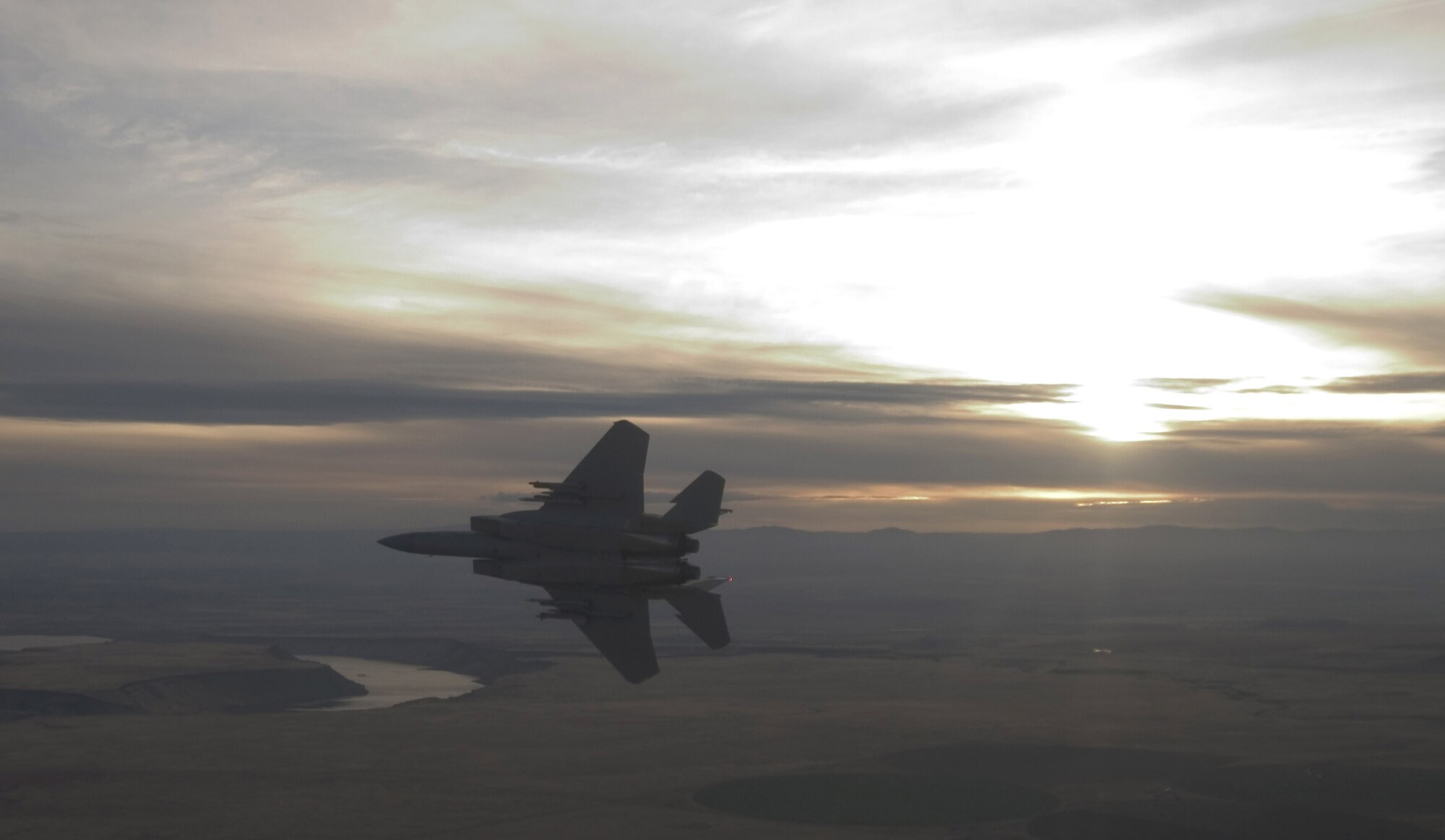 An F-15 Eagle from the 366th Fighter Wing pitches out for landing over Mountain Home Air Force Base, Idaho, Nov. 1. The 366th Fighter Wing began the first phase of its F-16 Fighting Falcon drawdown when five jets departed the base Nov. 2. The departure is part of the wing's realignment from an F-16, F-15C and F-15E base to an all F-15E Strike Eagle installation by 2011. The move, outlined in the 2005 Base Realignment and Closure recommendation, is also part of the Air Force initiative to become a smarter and leaner force by consolidating its F-15 and F-16 fighter aircraft. (U.S. Air Force photo/Master Sgt. Kevin J. Gruenwald)
