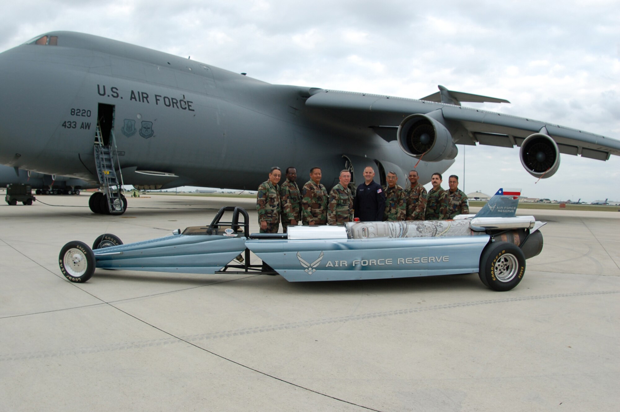 Sponsored by the Air Force Reserve, Bill Braak, a former Reserve C-141 flight engineer turned driver, appeared at the Lackland AFB Airfest 2006, november 4-5, with his Air Force Reserve Rocket car. The car utilizes a Westinghouse J34-48. Originally used in the North American Buckeye T-2A aircraft. Bill, center is surrounded by the members of the 433rd Maintenance Group sheetmetal shop. The Reservists helped get the car back into action after the first day of performances caused a couple of small tears in the metal bands reenforcing the canister in the aft section of the car.
