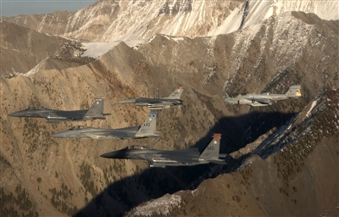 A five-ship formation consisting of two F-15E Strike Eagles, an F-15C Eagle, and an F-16 Fighting Falcon from Mountain Home Air Force Base, Idaho, and an EA-6B Prowler from the 388th Electronic Control Squadron, Naval Air Station Whidbey Island, Wash., fly over the Sawtooth Mountains in Idaho, Nov. 1, 2006. 