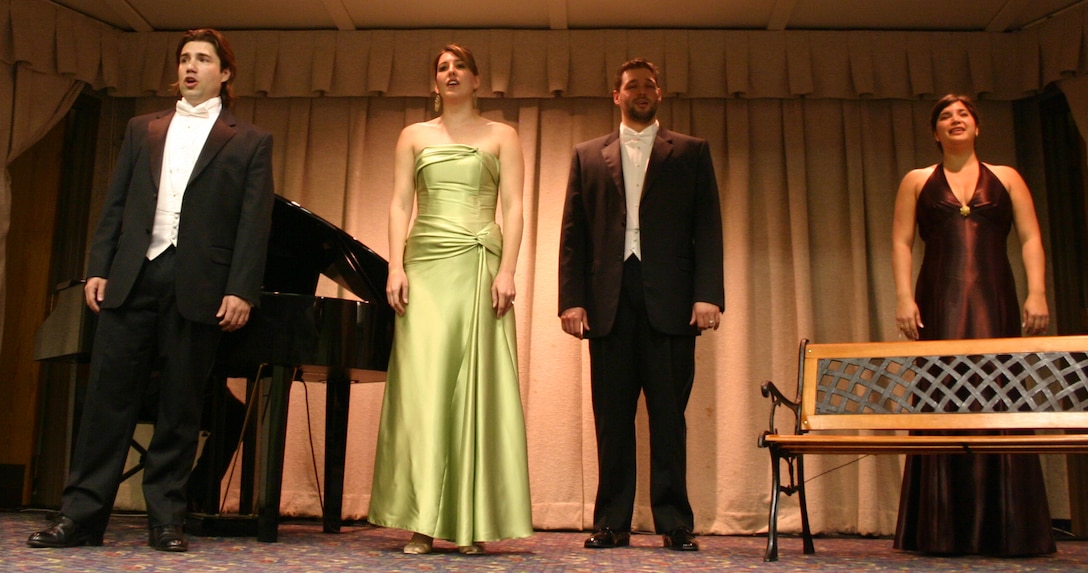 From left to right, Fort Worth Opera vocalists tenor Benjamin Bunsold, soprano Tawny Seward, baritone Brandon Poor and mezzo-soprano Laura Mercado perform at the officers club April 7. (U.S. Air Force Photo/Staff Sgt. Tonnette Thompson).