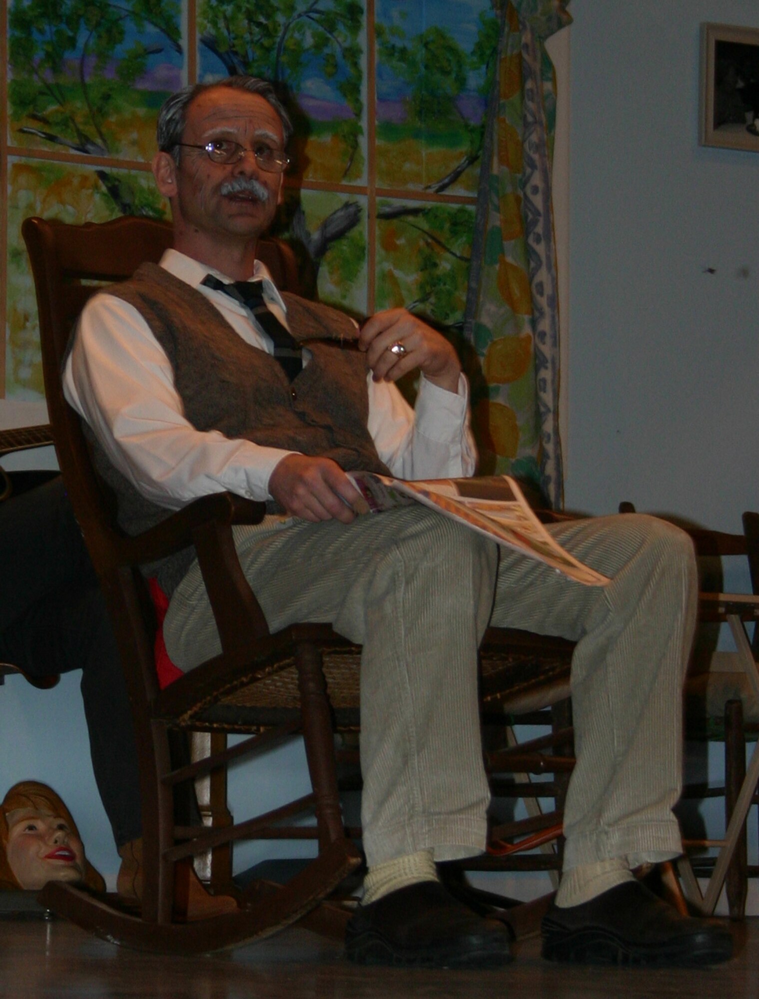 Martin Vanderhof, played by Capt. Chris Van Vliet, is the grandfather and focal point of “You Can’t Take it with You,” a play put on by the ENJJPT Players, a theatrical troupe made up of Euro-NATO Joint Jet Pilot Training personnel. (U.S. Air Force Photo/Staff Sgt. Tonnette Thompson).