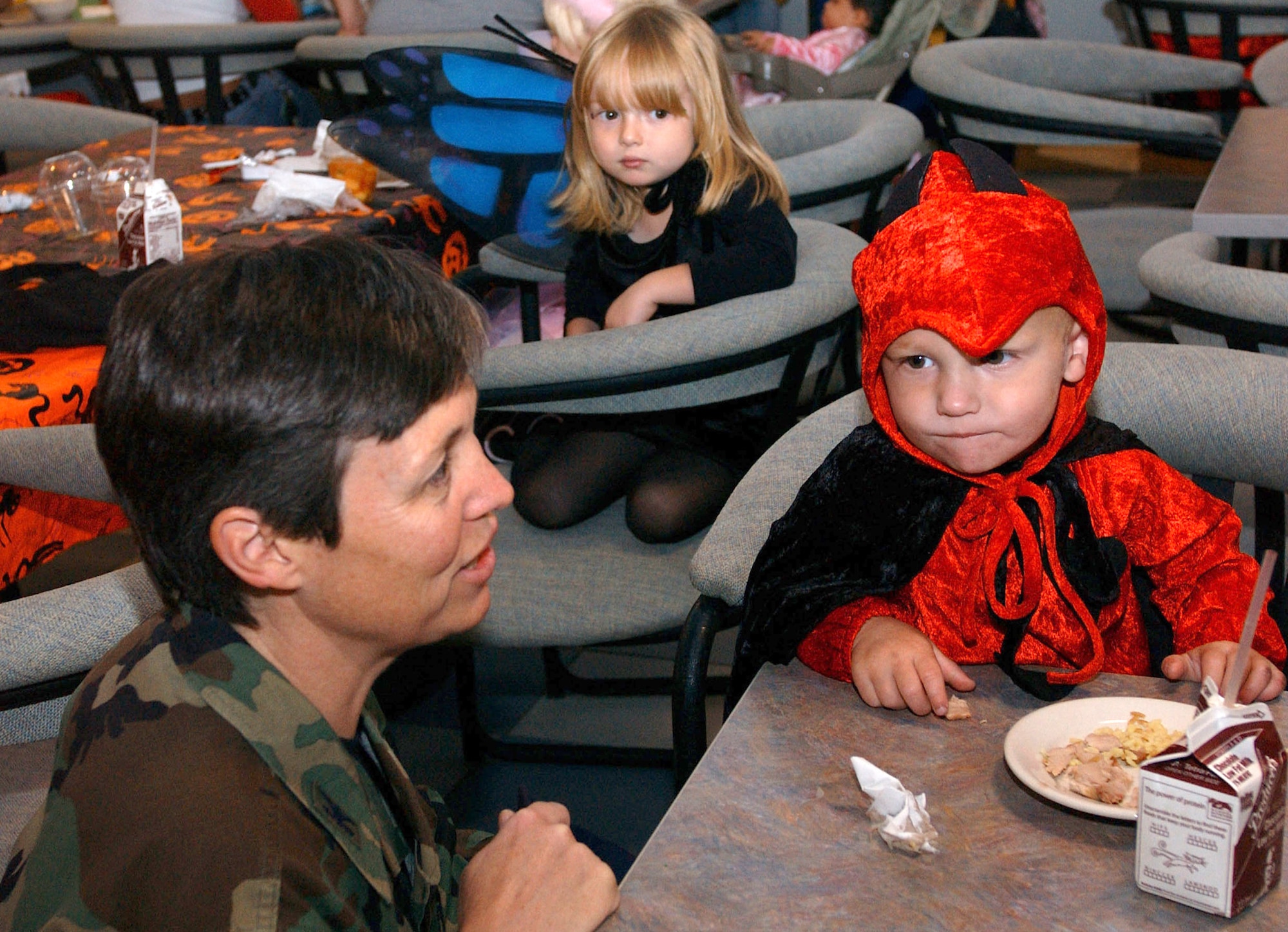 Col. Terry Djuric, 30th Space Wings vice commmander, speaks with the children at the Deployed Spouses Halloween Costume Party Oct. 26 at the Breakers Dinning Facility here. The party was sponsored by the Family Support Center and the 30th Services Division to help keep moral high and bring the families of deployed Airmen together. (U.S. Air Force photo/Airman Nichelle K. Griffiths)