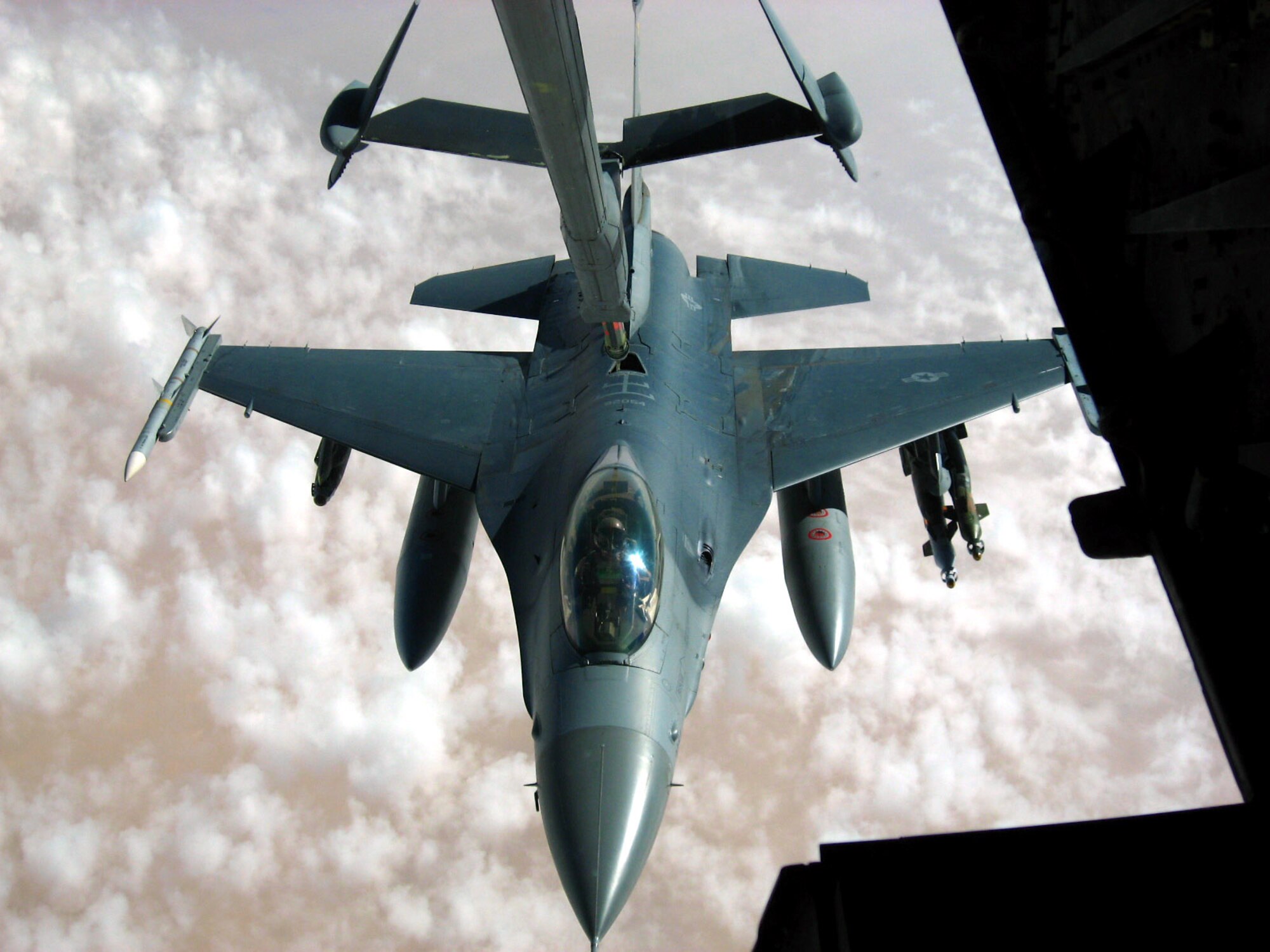 An F-16 Fighting Falcon from the New York Air National Guard takes fuel from a KC-10 Extender from the 380th Air Expeditionary Wing over Iraq Nov. 4. The 380th AEW is the largest air refueling unit in Southwest Asia, using KC-10s and KC-135 Stratotankers to fuel U.S. and allied aircraft. (U.S. Air Force photo/Capt. Justin T. Watson)