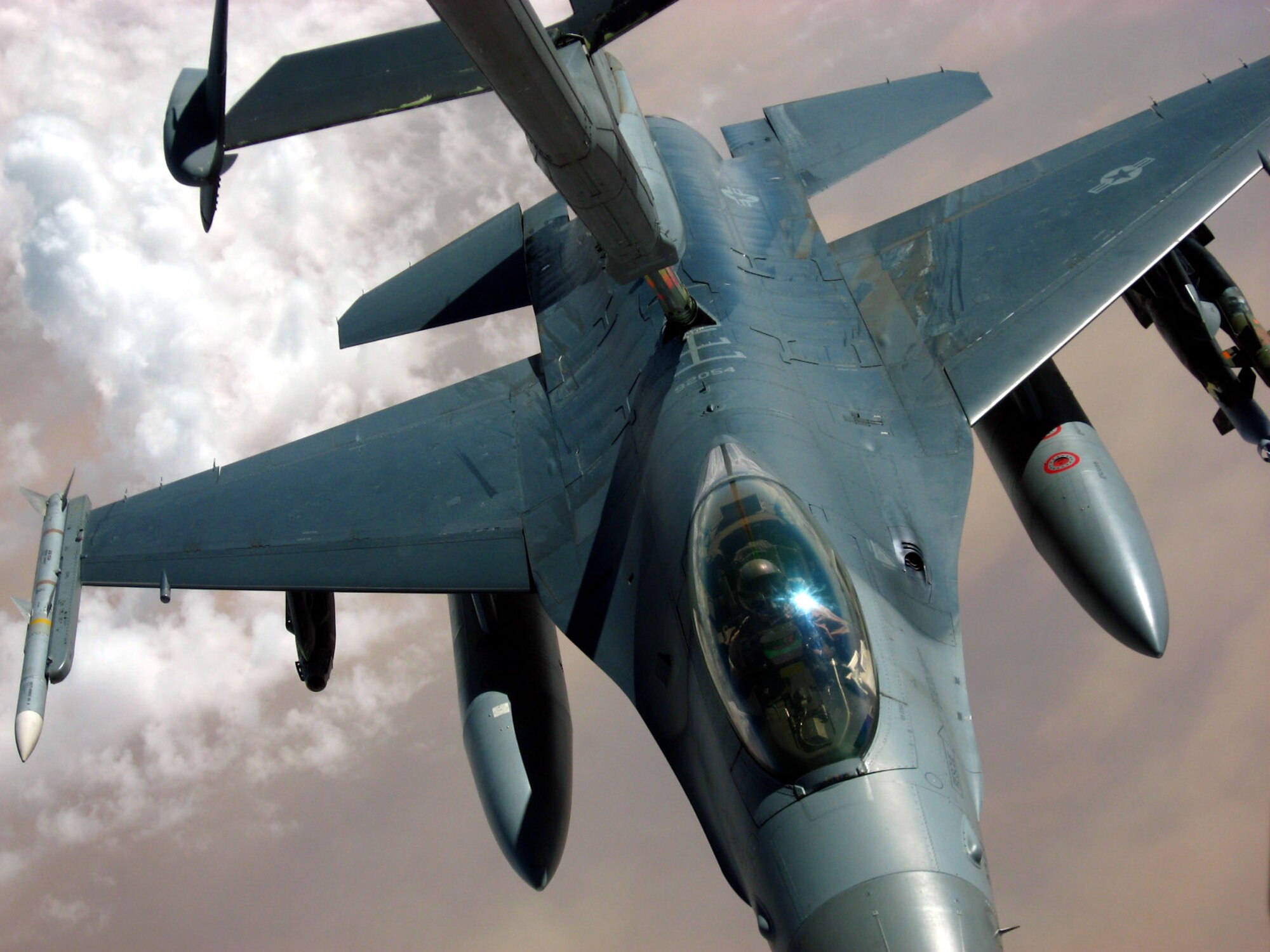An F-16 Fighting Falcon from the New York Air National Guard takes fuel from a KC-10 Extender from the 380th Air Expeditionary Wing over Iraq Nov. 4. The 380th AEW is the largest air refueling unit in Southwest Asia, using KC-10s and KC-135 Stratotankers to fuel U.S. and allied aircraft. (U.S. Air Force photo/Capt. Justin T. Watson)