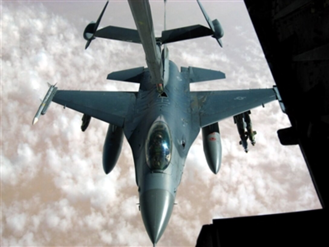 An F-16 Fighting Falcon from the New York Air National Guard takes fuel from a KC-10 Extender over Iraq, Nov. 4.