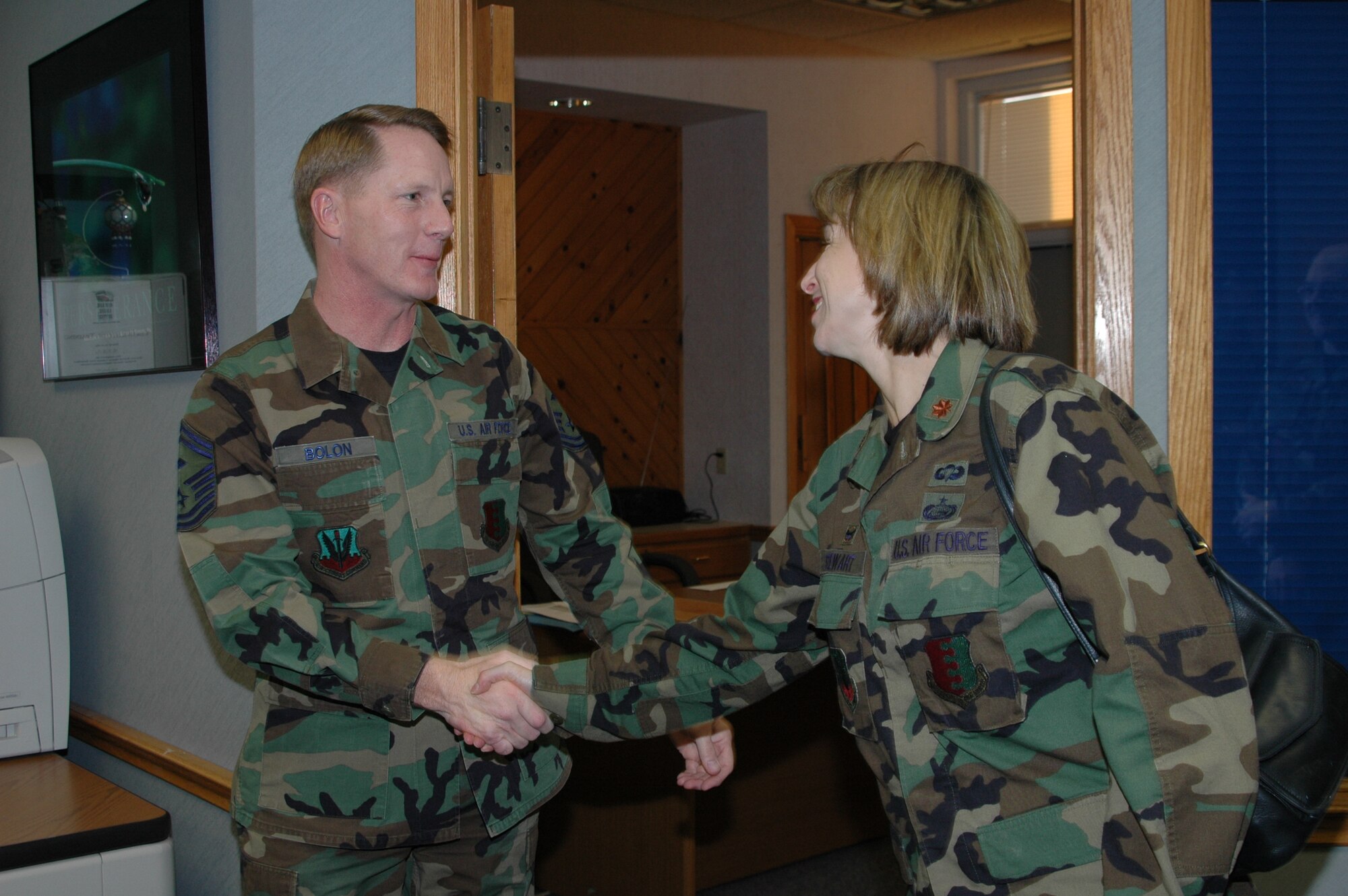 28th Bomb Wing leadership congratulates, Senior Master Sgt. Timothy Bolon, 28th Civil Engineer Squadron, one of the newest chiefs as announced Nov. 8. More than 30 members of the wing leadership loaded up a bus Wednesday morning and traveled to all four selectees' offices to congratulate them.