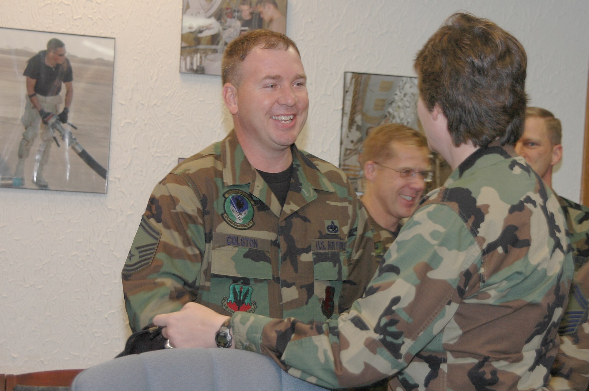 28th Bomb Wing leadership congratulates, Senior Master Sgt. DeWayne Colston, 28th Maintenance Operations Squadron, one of the newest chiefs as announced Nov. 8. More than 30 members of the wing leadership loaded up a bus and traveled to all four selectees' offices to congratulate them.