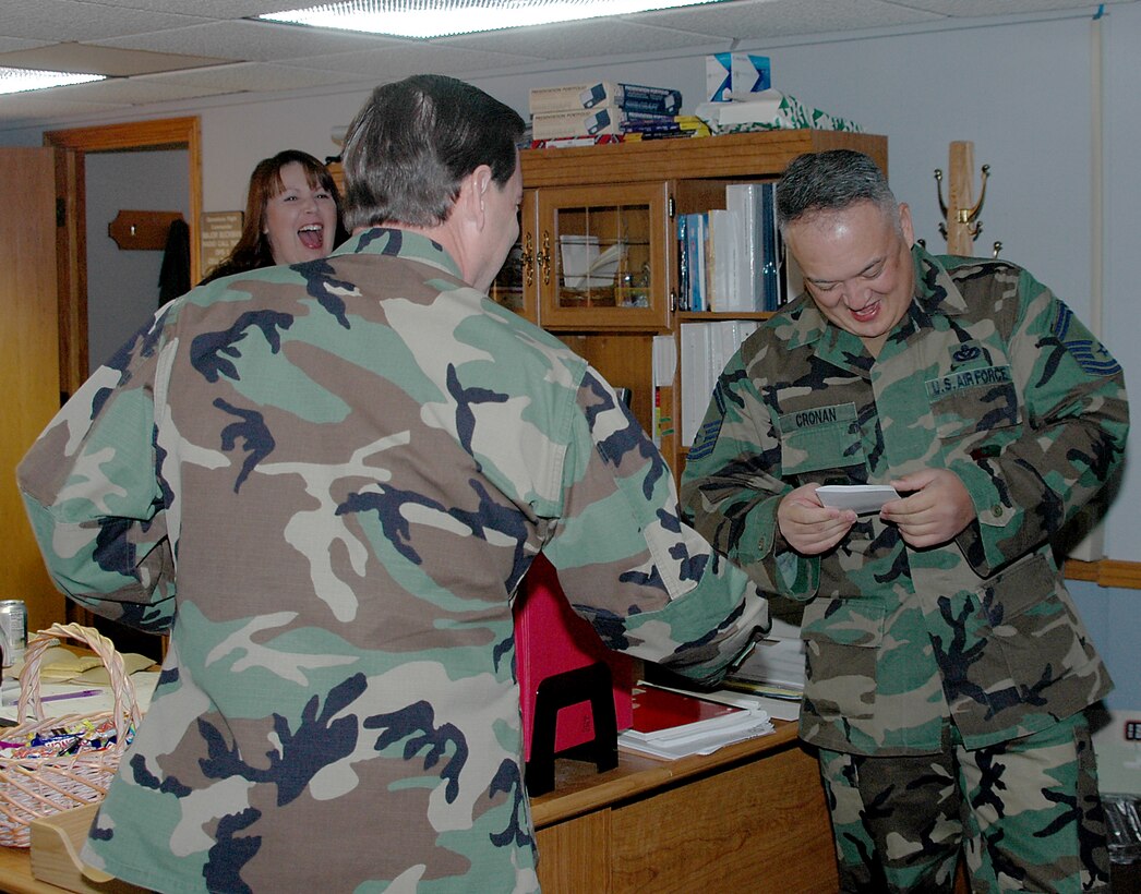 28th Bomb Wing leadership congratulates, Senior Master Sgt. Robert Cronan, 28th Civil Engineer Squadron, one of the newest chiefs as announced Nov. 8. More than 30 members of the wing leadership loaded up a bus and traveled to all four selectees' offices to congratulate them.