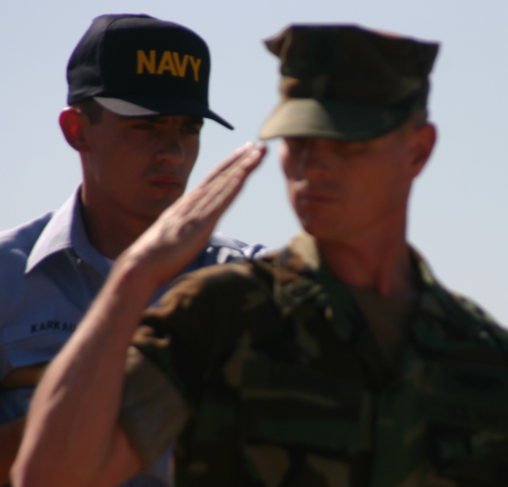 Senior Chief Petty Officer Benno Lederer of the Navy Seabee detachment here renders a salute while passing the reviewing stand during the Armed Forces Day Parade May 19. It was the first parade on Sheppard’s new parade field. Also pictured is Seaman Recruit Vincent Karkau.   (U.S. Air Force photo/John Ingle).