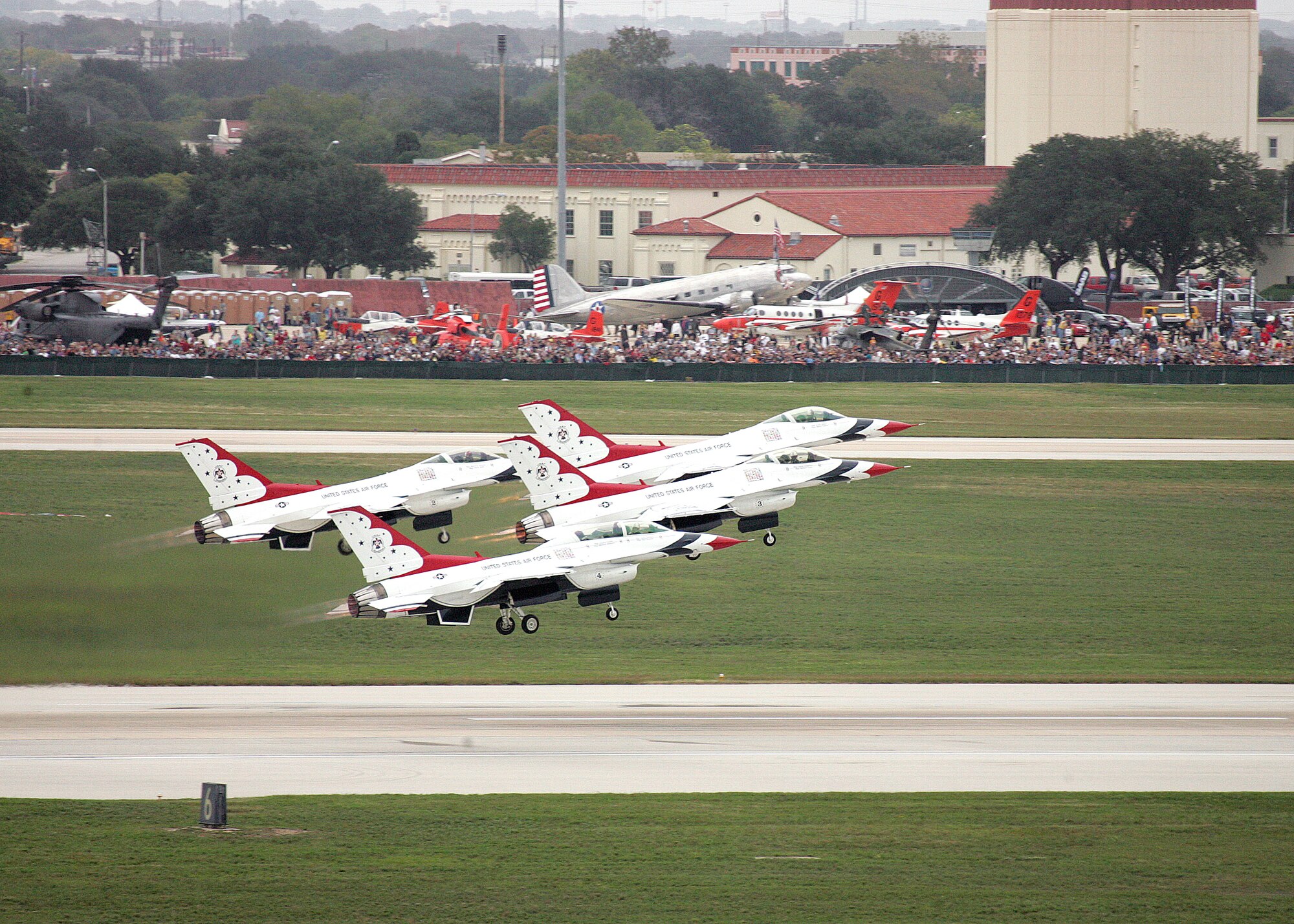 The U. S. Air Force Thunderbirds take off for their final road show performance Nov. 5 at Lackland Air Force Base, Texas.  An estimated crowd of 250,00 attended the two-day air show at Lackland AFB. (U.S. Air Force photo/Robbin Cresswell)