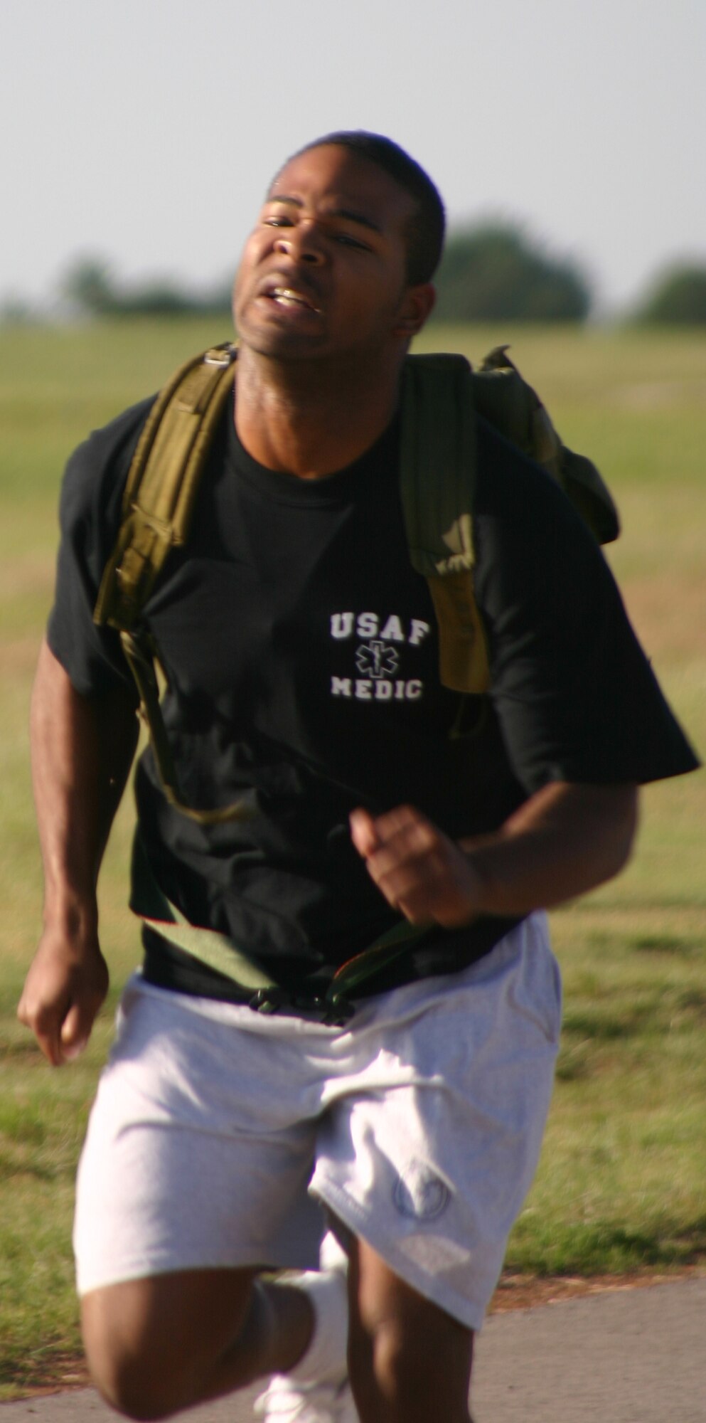 Marcus Pender from the 383rd Training Squadron participates in the rucksack relay Saturday. Pender, along with other participants, ran the relay carrying a rucksack filled with 30 pounds of sand. (U.S. Air Force photo/Airman Jacob Corbin).