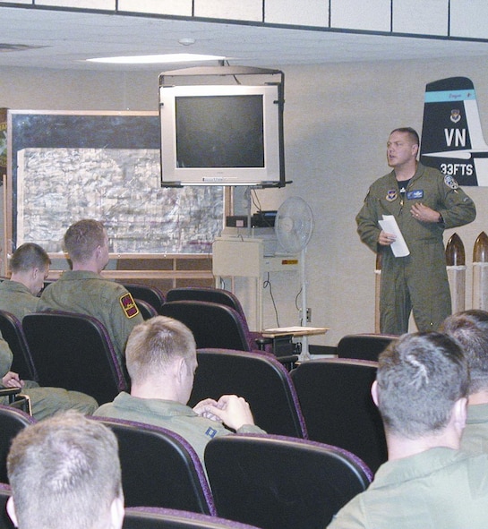 Colonel Hill briefs squadron issues to the 25th FTS during a commander’s call recently. He also recognized several of the squadron’s award winners.(Photo by Capt Tony Wickman)