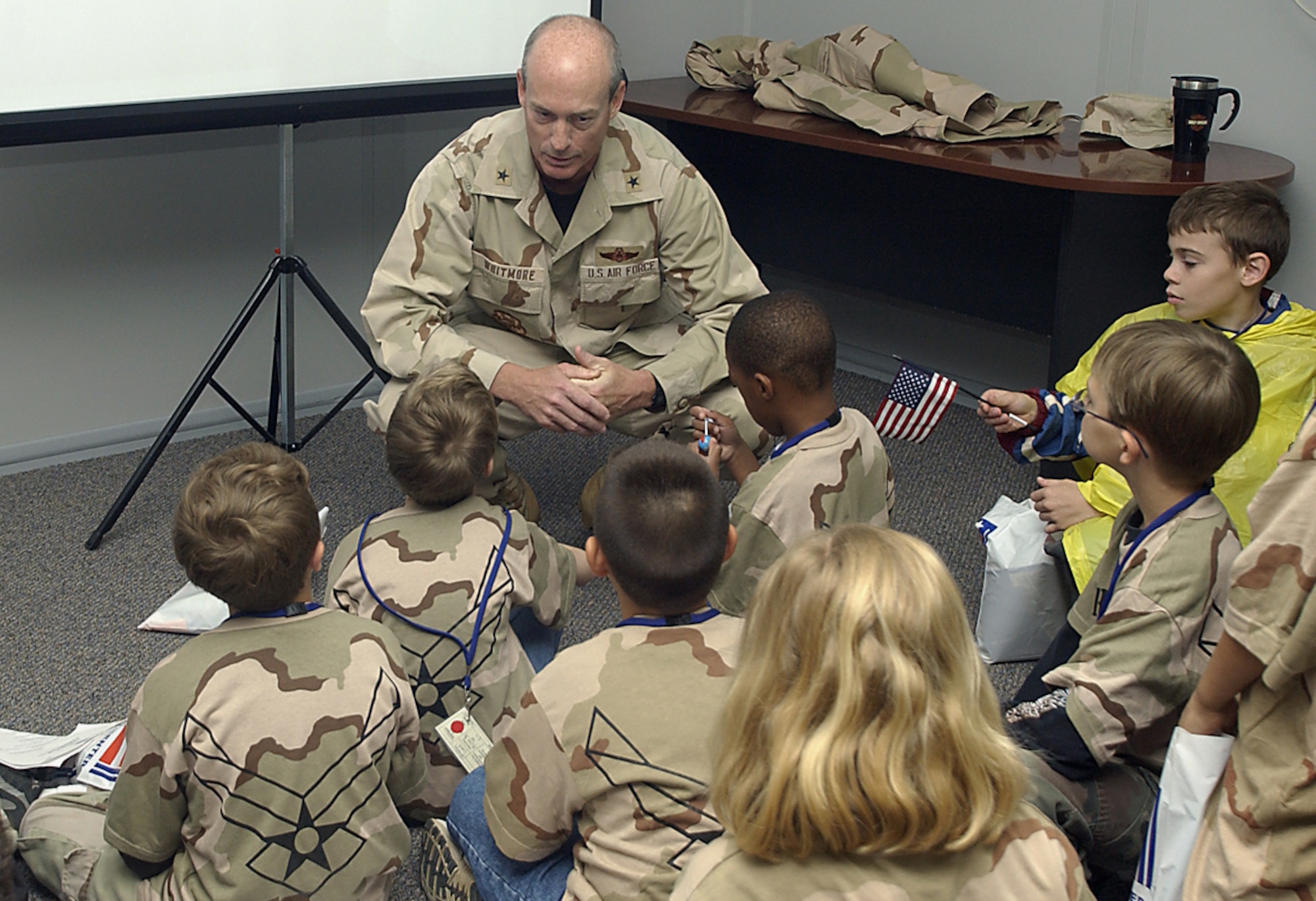 Brig. Gen. James Whitmore, 82nd Training Wing commander, briefs personnel – a.k.a. dependent children of Team Sheppard members – before they deploy to Camp Liberty at an unknown location. (U.S. Air Force photo/Mike Litteken).