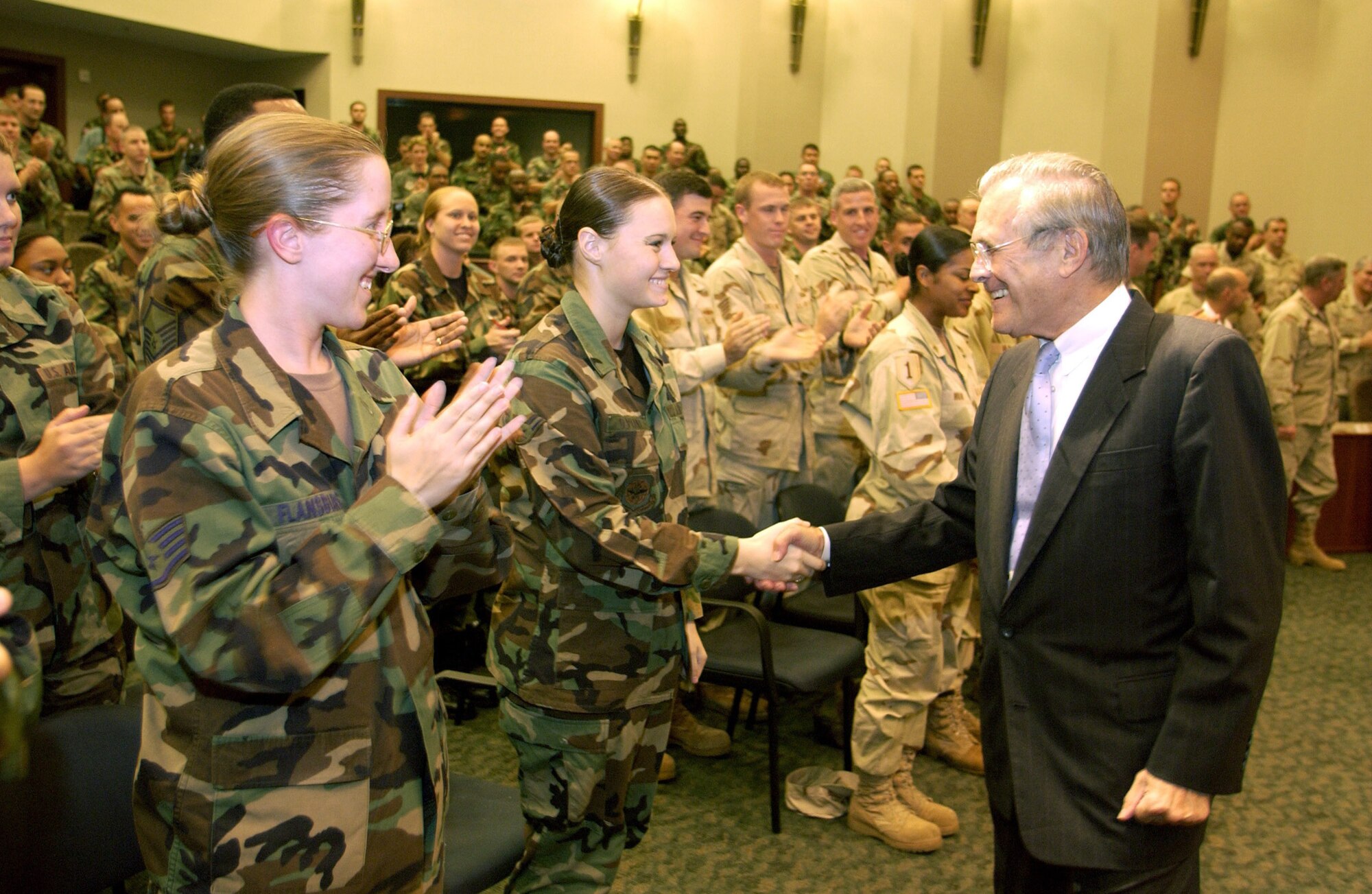 Donald H. Rumsfeld, greeting Airmen at MacDill Air Force Base, Fla., has stepped down as secretary of defense.  Mr. Rumsfeld and President George Bush issued a statement Nov. 8 that they agreed the time had come for a change in leadership in the Pentagon. (U.S. Air Force photo by Master Sgt. James M. Bowman)