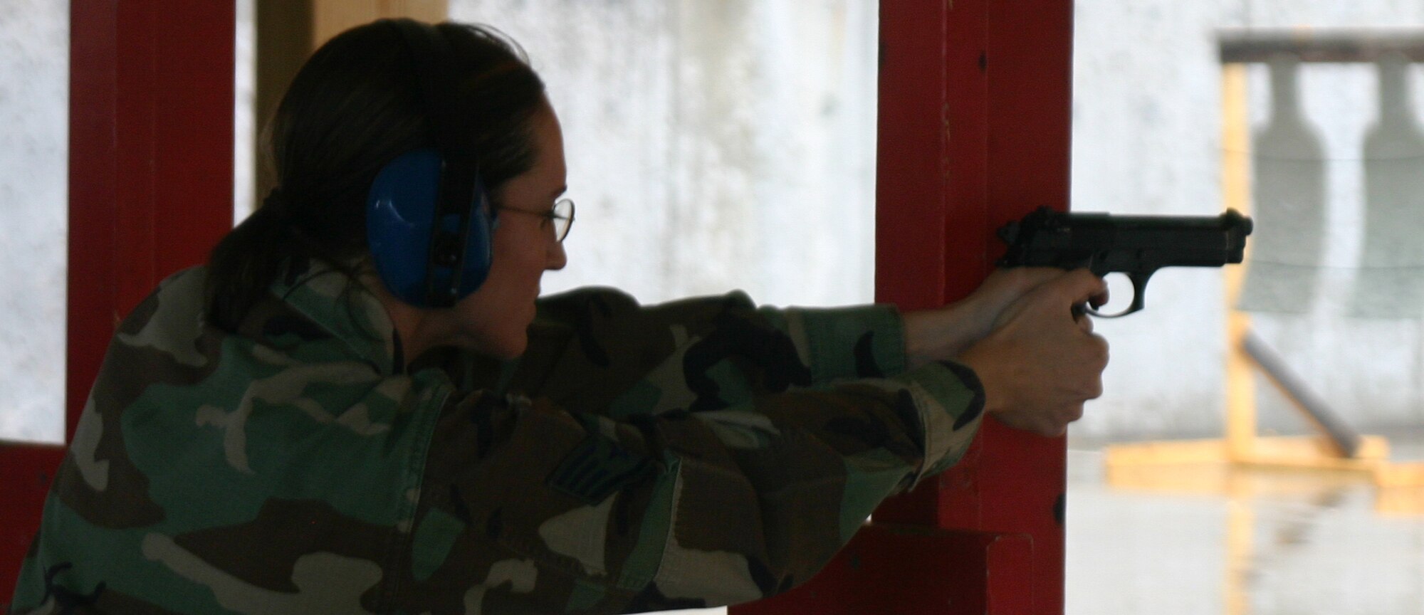 Staff Sgt. Wendi Zook, an individual mobilization augmentee with the 82nd Security Forces Squadron, uses a post for stability during firing range practice April 28. (U.S. Air Force photo/Airman Jacob Corbin).