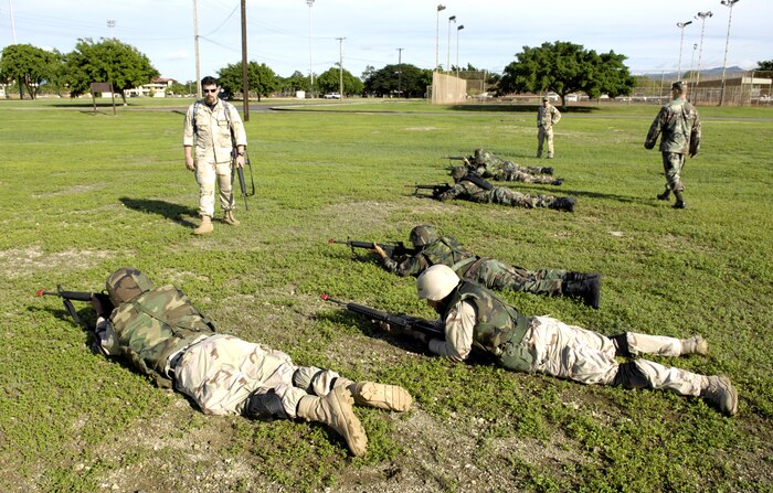 Instructors go through individual movement techniques Nov. 3 with students from the 15th Airlift Wing during a 3-day Expeditionary Combat Skills Training course at Hickam Air Force Base, Hawaii. The Airmen are preparing for the Air Expeditionary Force 5/6 cycle. (U.S. Air Force photo by/Tech. Sgt. Shane A. Cuomo)