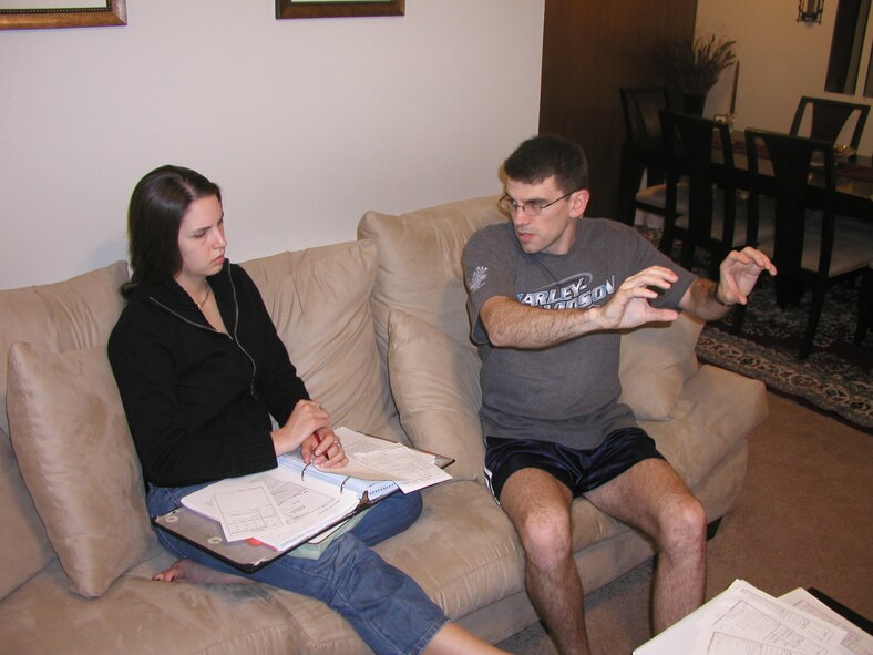 Second Lt. Annalee Thurber, Class 07-05 student pilot and Lieutenant Lieber’s fiancée, reviews aerobatic maneuvers on their off-duty time.(Photo by Capt. Tony Wickman)