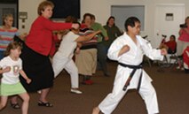 Eighth-degree blackbelt Sensei Tanaka of Martial Arts Academy in Anchorage, Alaska (right), teaches Team Vance members how to defend themselves Thursday during a self-defense class in observance of Sexual Assault Awareness Month.