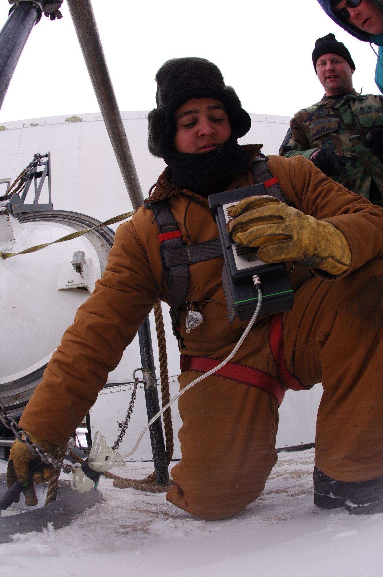 MINOT AIR FORCE BASE, N.D. -- Senior Airman Edwin Acosta Jr., 91st Missile Maintenance Squadron, checks the oxygen levels in the confined space before allowing entry after the simulated electronic missile launch conducted at Mike 11 Nov. 1. (U.S. Air Force photo by Staff Sgt. Joe Laws)
