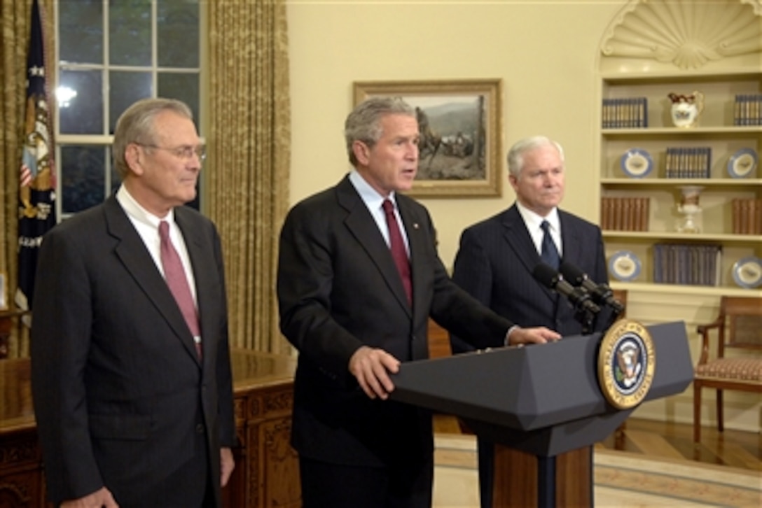 President George W. Bush, center, Defense Secretary Donald H. Rumsfeld, left, and Secretary of Defense nominee Robert Gates address the nation during a news conference, Nov. 8, 2006, from the White House. 
